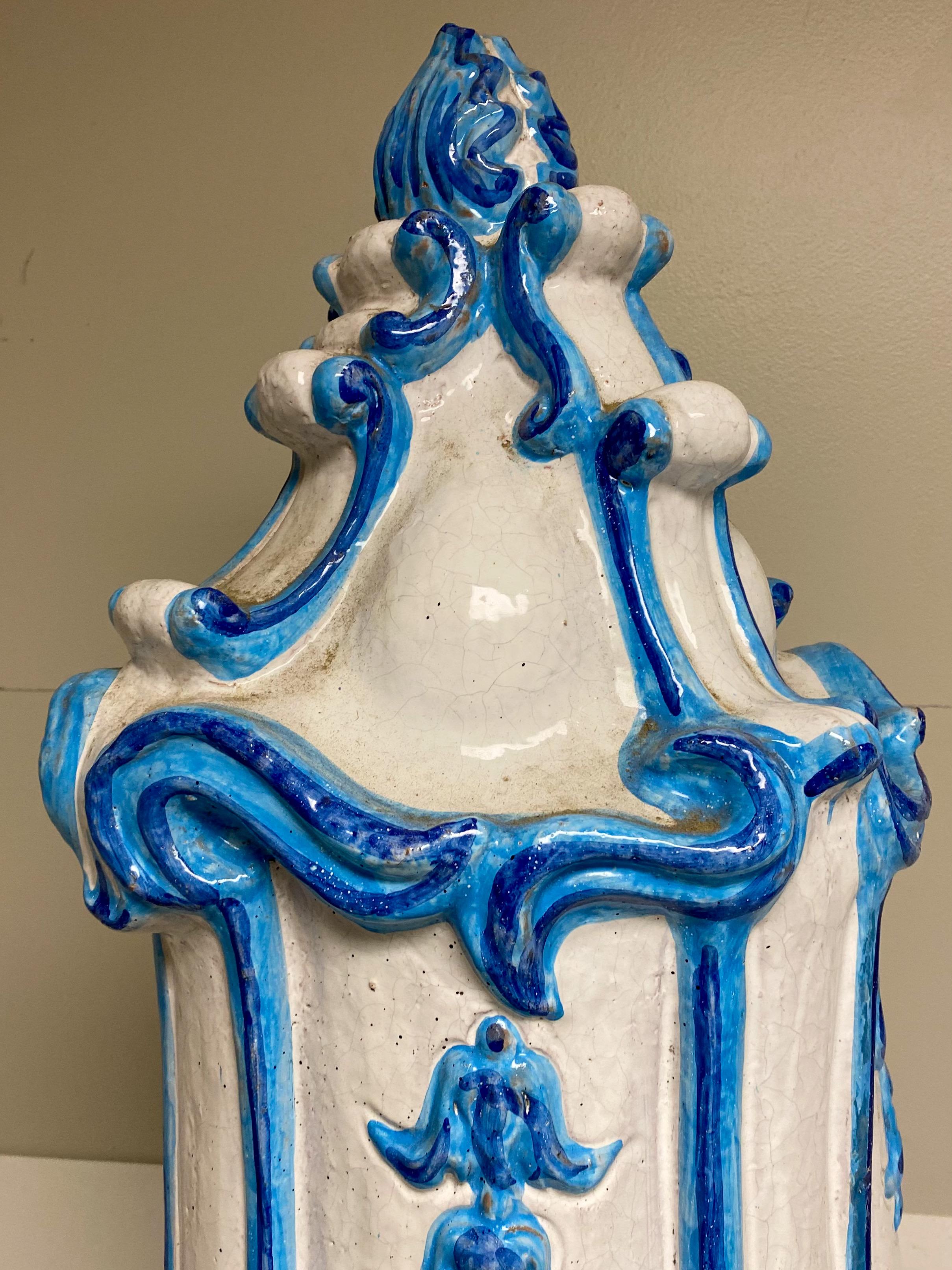 This is an antique Italian majolica terracotta blue and white parlor stove. It is in wonderful condition and breaks down into four pieces for ease with regard to shipping.