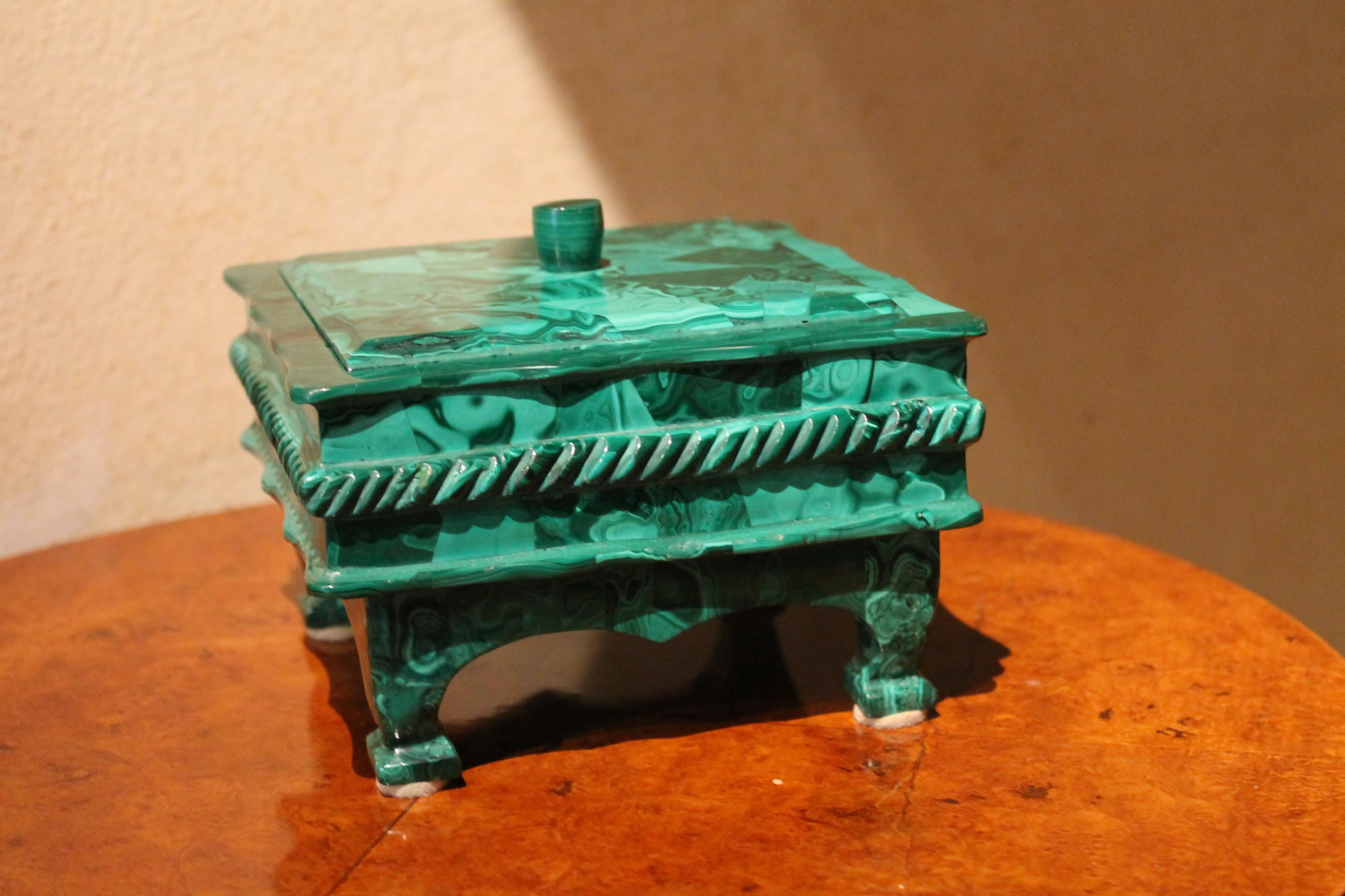Malachite, one of the most sought after and wonderful semi-precious stones, is the material with which this delightful late 19th-early 20th century lidded box is made of. The workmanship is equally sought after, the jewelry or trinket box features