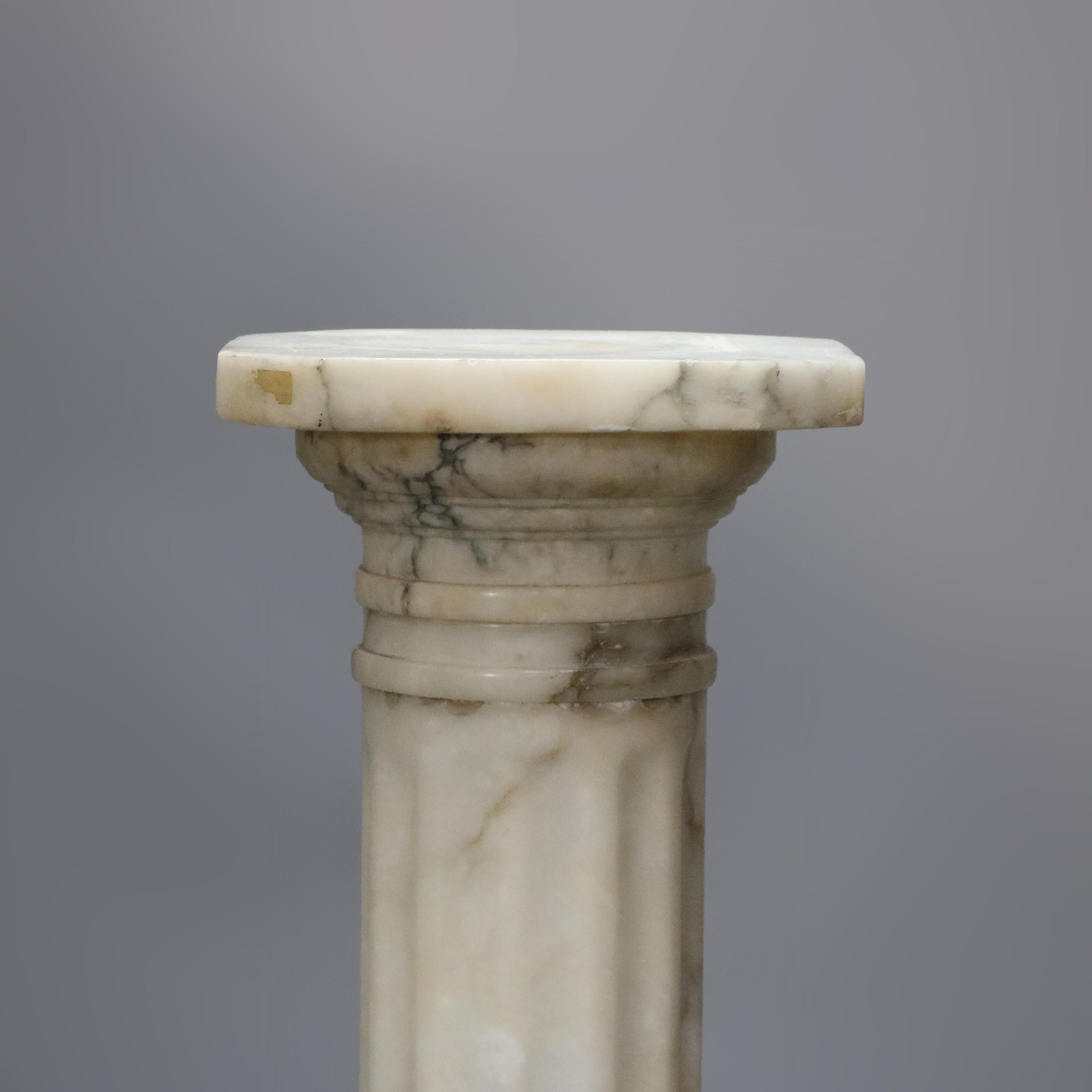 An antique Italian carved marble sculpture pedestal offers Classical Greek Doric column form with clip corner display surmounting fluted column with decorated band, seated on stepped base, circa 1890

Measures: 36.25