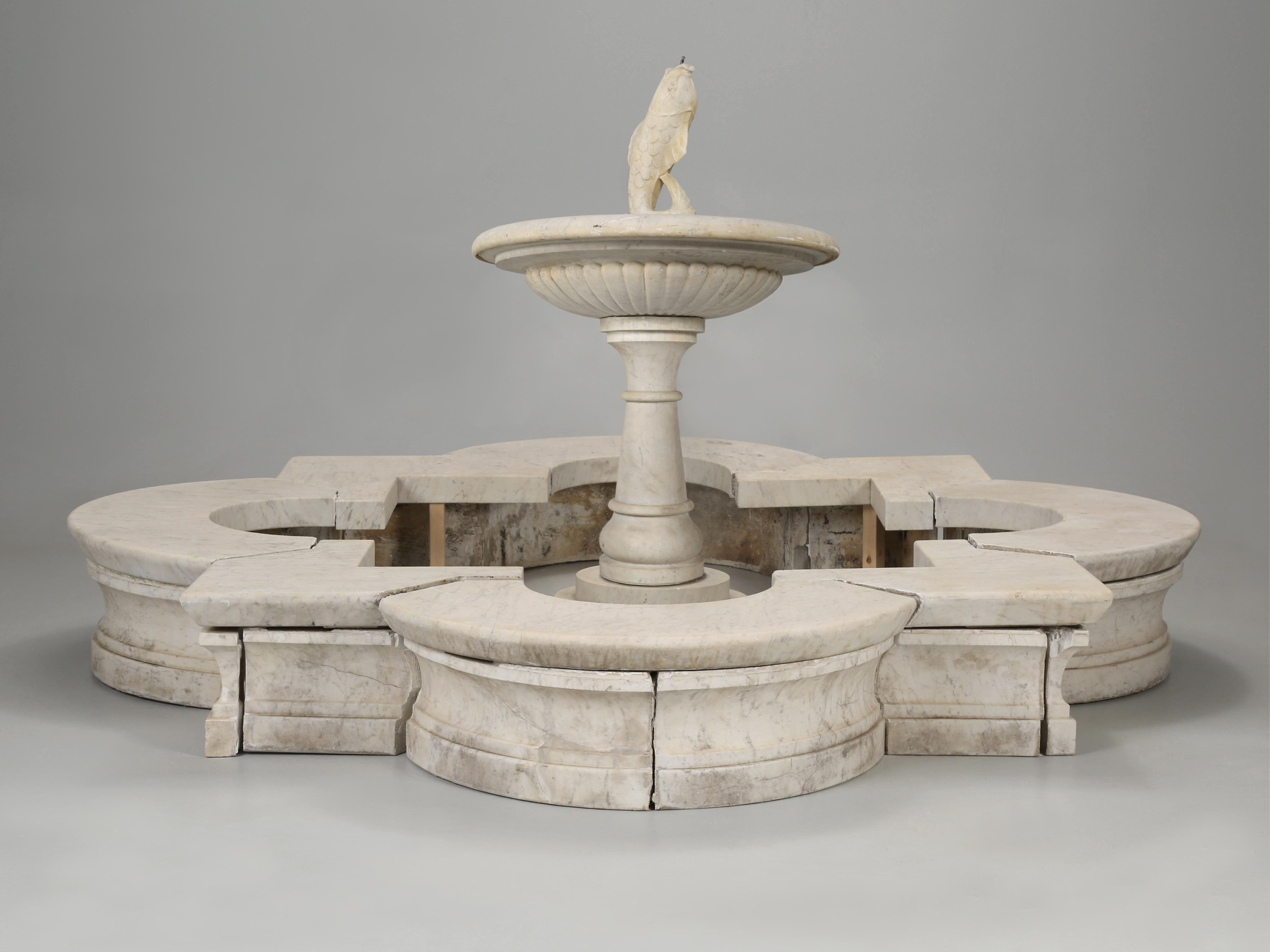 Exquisite and rare Antique Italian Hand-Carved Marble Fountain with a Classic Quatrefoil Basin and Fish Spout, that was removed from a Chicago mansion. The quatrefoil design dates back to 850BC and means four leaves and is a symbol for good luck. We
