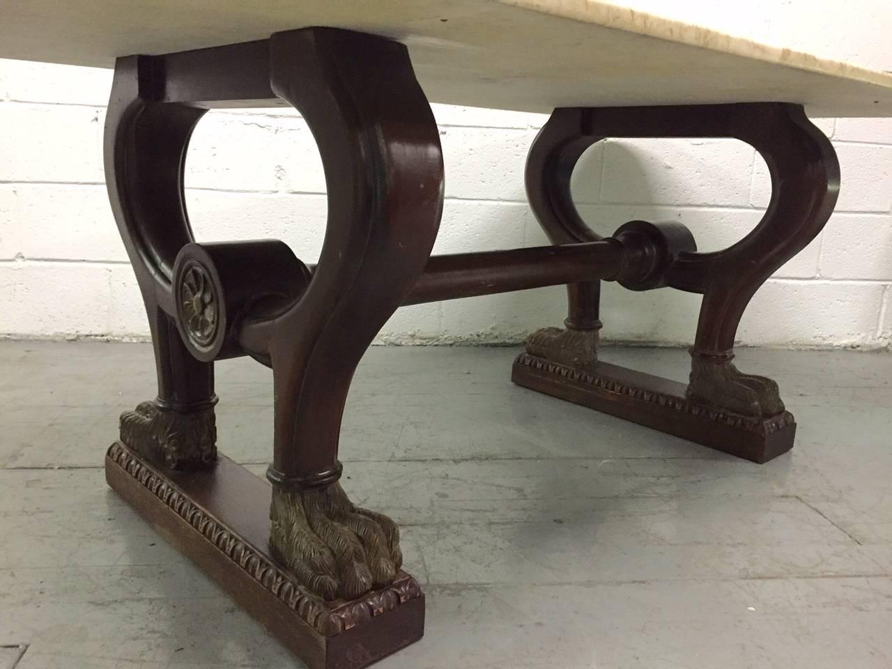 Solid walnut base with a large Italian marble top and paw feet.
  