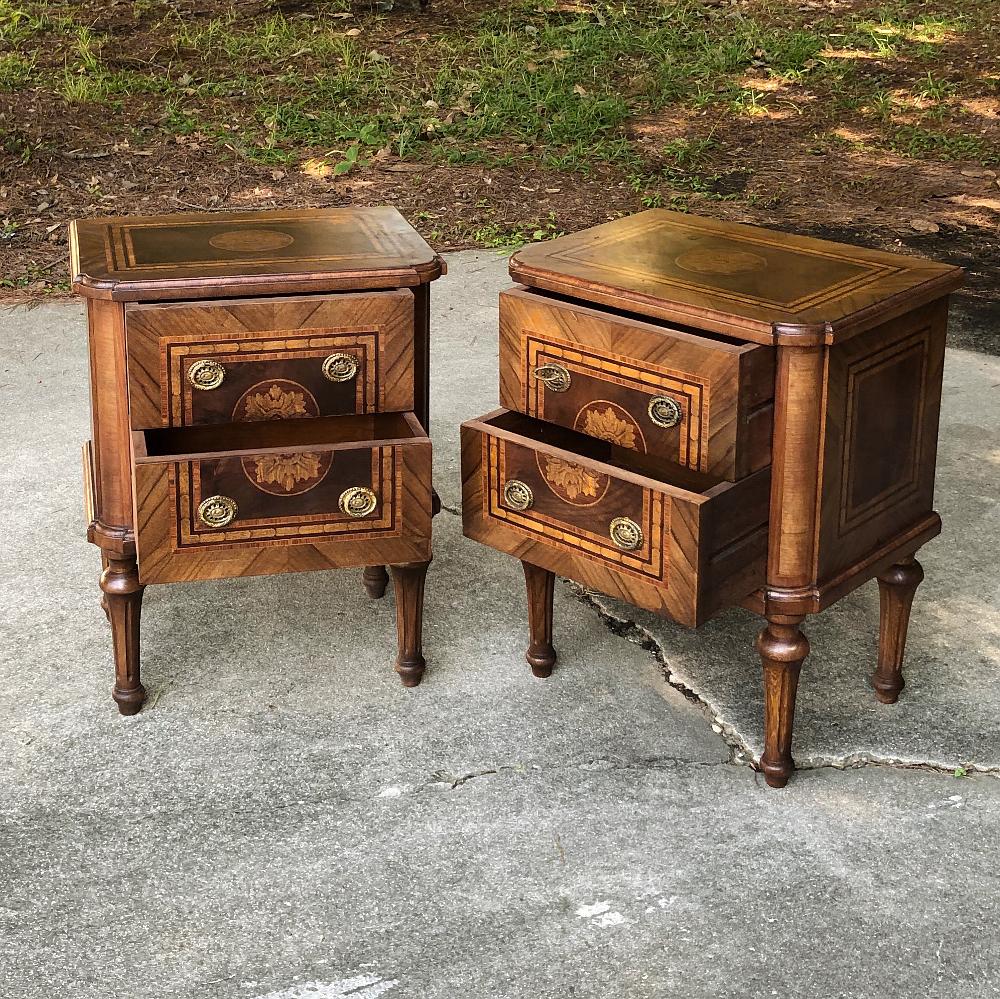 Pair of antique Italian marquetry nightstands is a splendid example of the master woodcrafter's art! Fine mahogany was used as a base into which satinwood, walnut and other woods were inlaid in an artistic pattern known as marquetry. Even the top