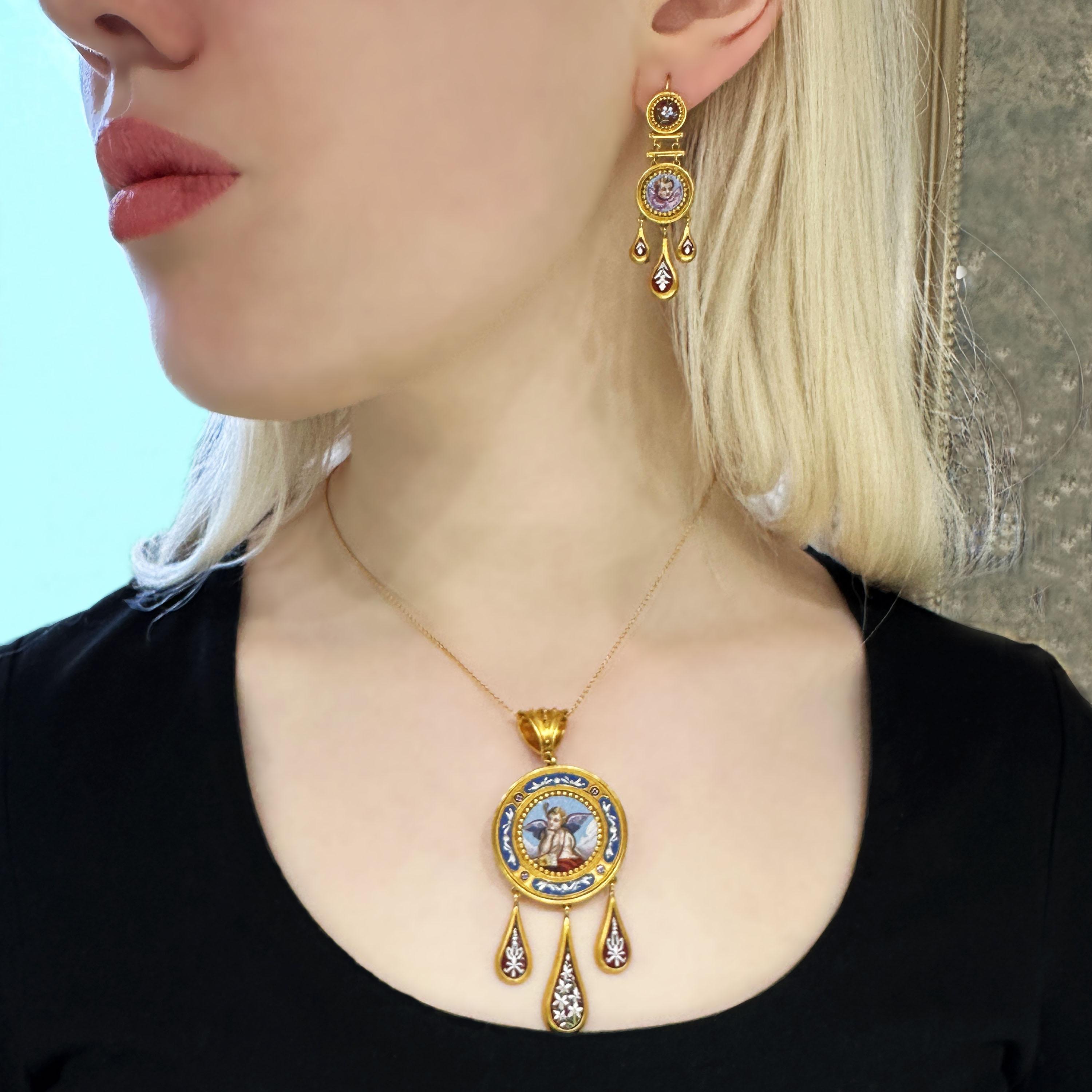 An antique Italian micromosaic and gold brooch-cum-pendant and earrings suite. The pendant has a gold bale, with granulated Etruscan style work, the central micromosaic features Cupid, with the sky as the background, with a circular surround of