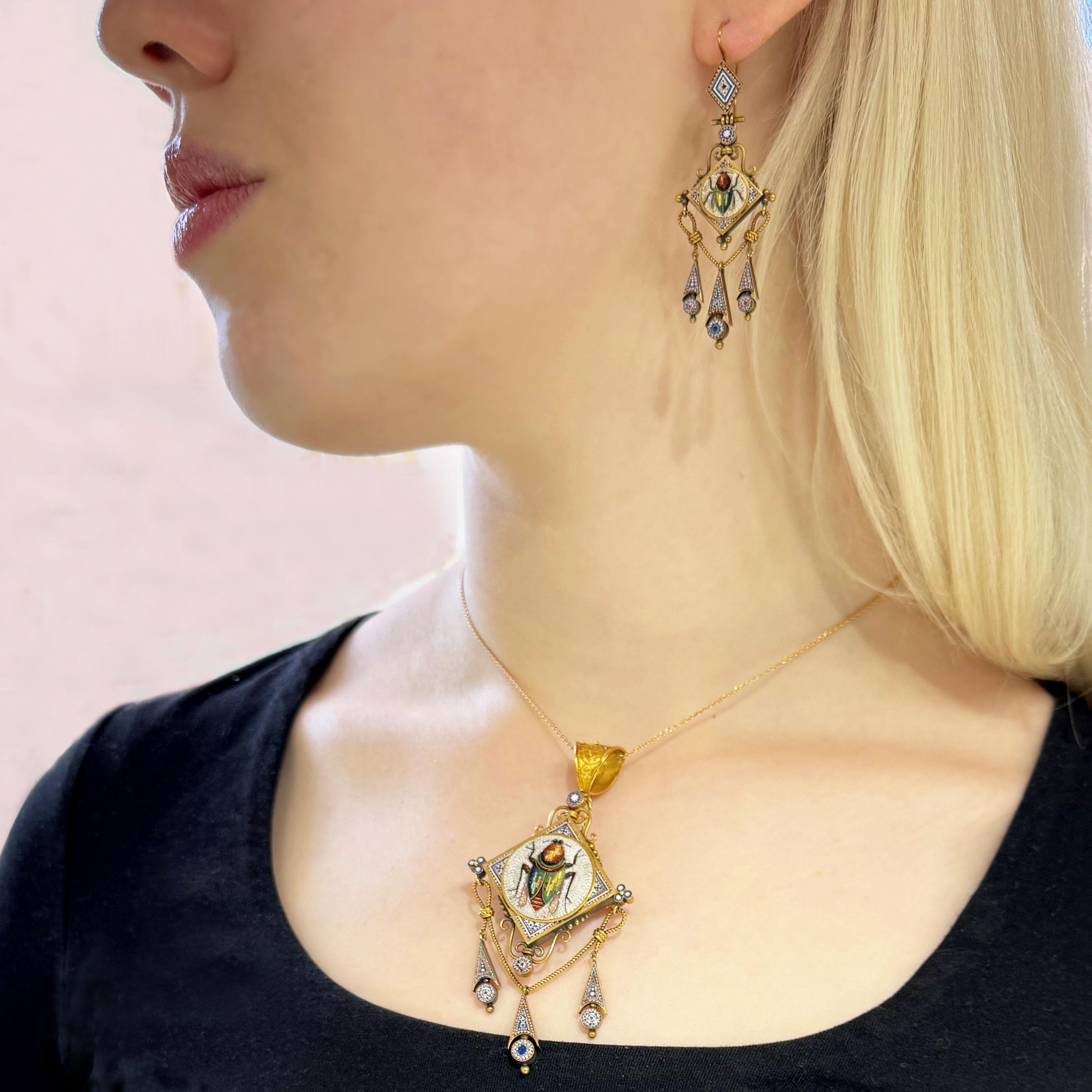 An antique Italian micromosaic and gold brooch-cum-pendant and earrings suite. The pendant has a gold bale, with granulated Etruscan style work, the micromosaic features a fly or beetle, with a green metallic abdomen and brown thorax, on a white