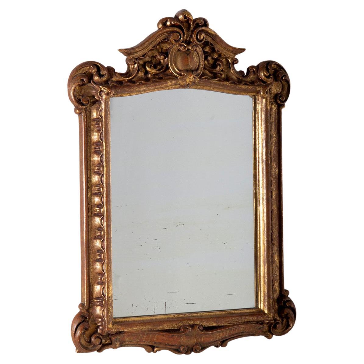Antique Italian mirror in gilded wood