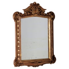 Antique Italian mirror in gilded wood