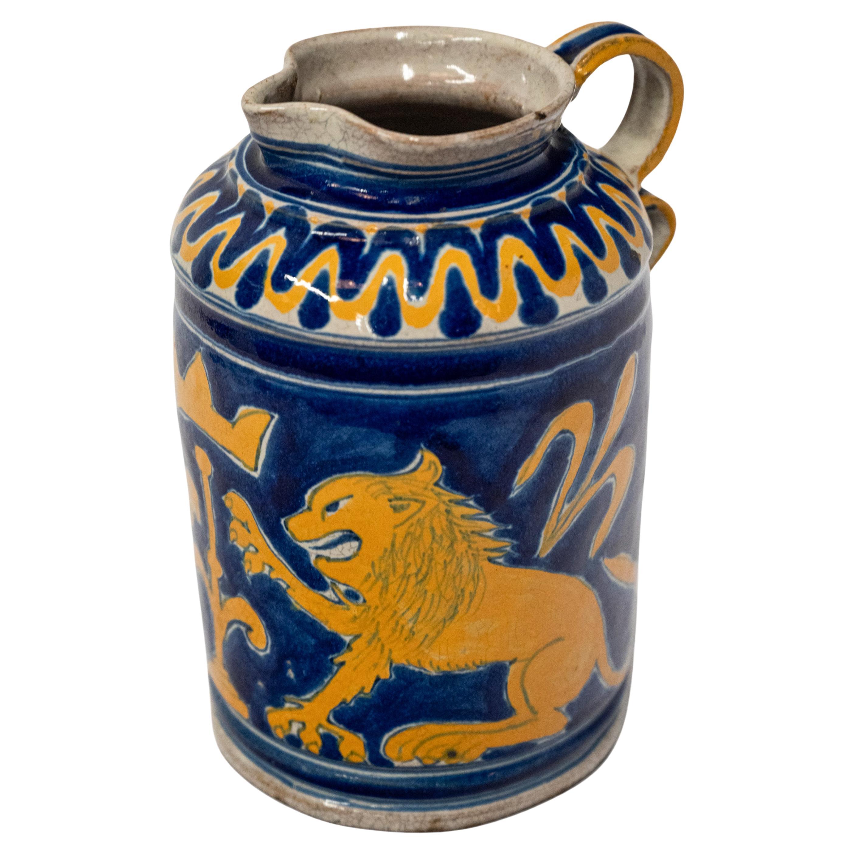 A very good antique Italian maiolica/majolica Renaissance armorial boccale or jug from the Montelupo area of Florence, circa 1600.
Typical of the tin glazed earthernware of the time this very handsome jug having a cobalt blue ground, the cream