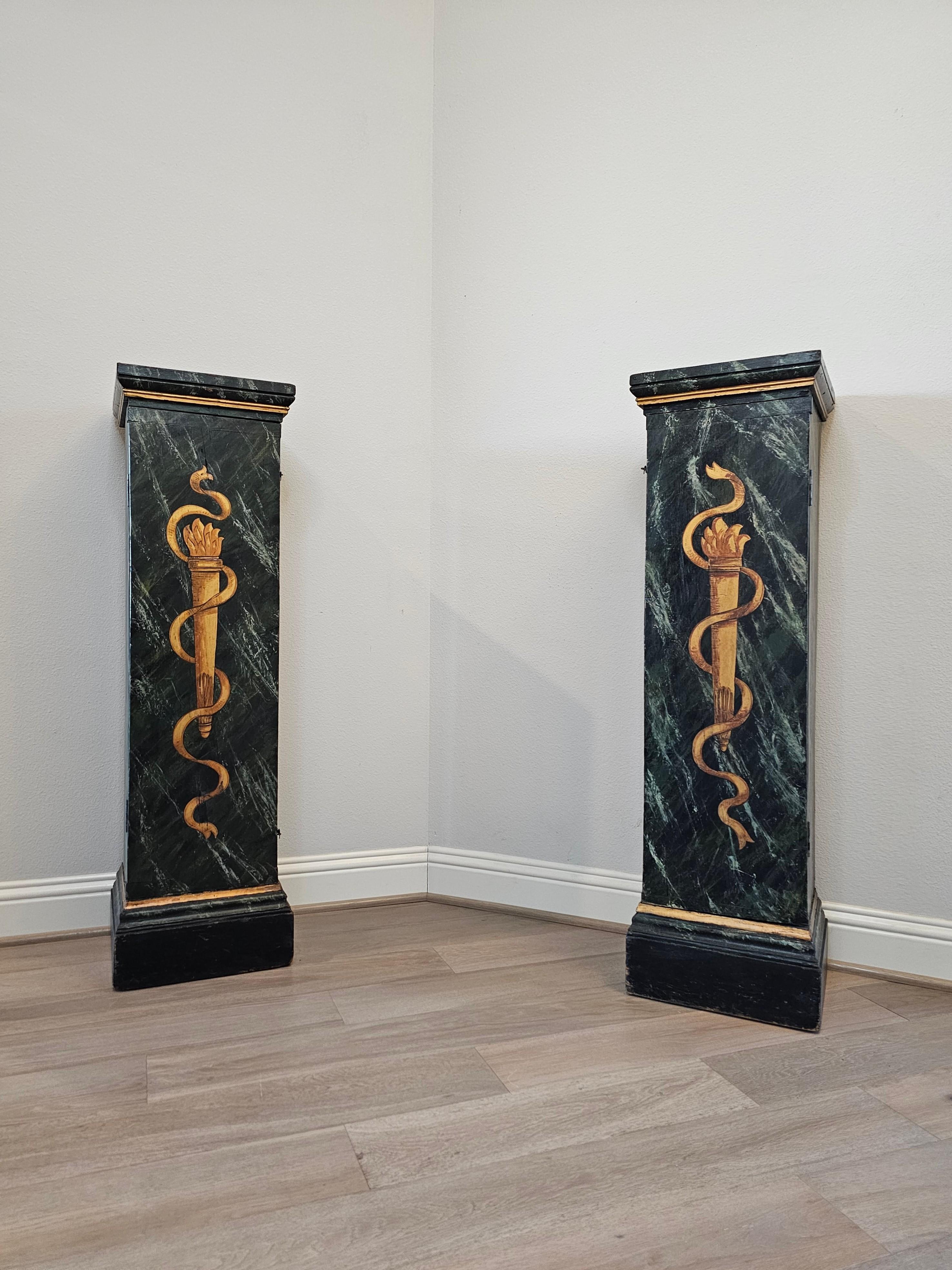 A most impressive pair of antique Italian Neo-classical style parcel gilt and faux marble painted wood pedestal cabinets with nicely aged distressed patina. 

Born in Italy in the 19th century, high-quality solid wooden construction, exceptionally