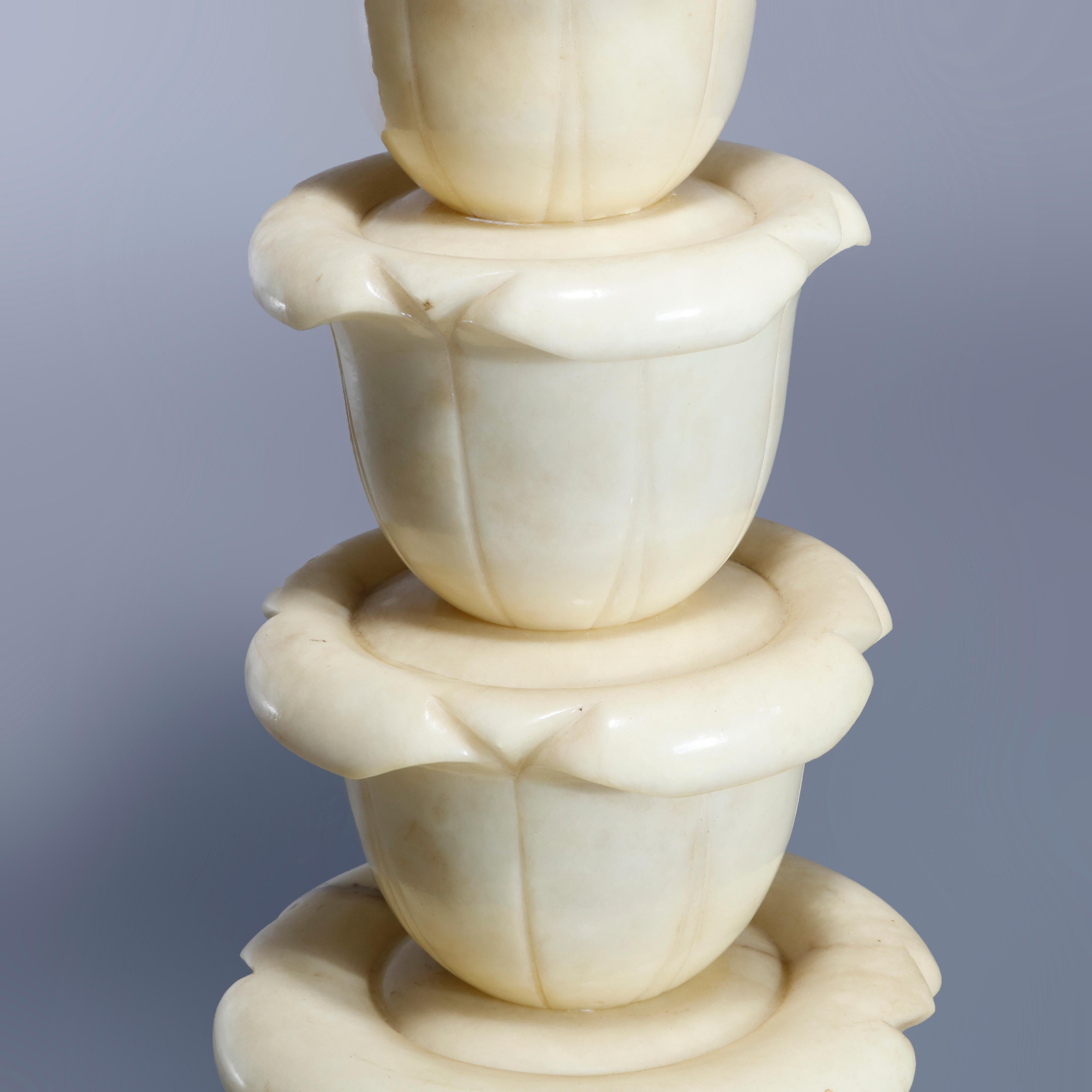 An antique Italian neoclassical sculpture pedestal offers clipped corner display over carved graduated belflower column seated on stepped octagonal base, circa 1920

Measures: 37.75