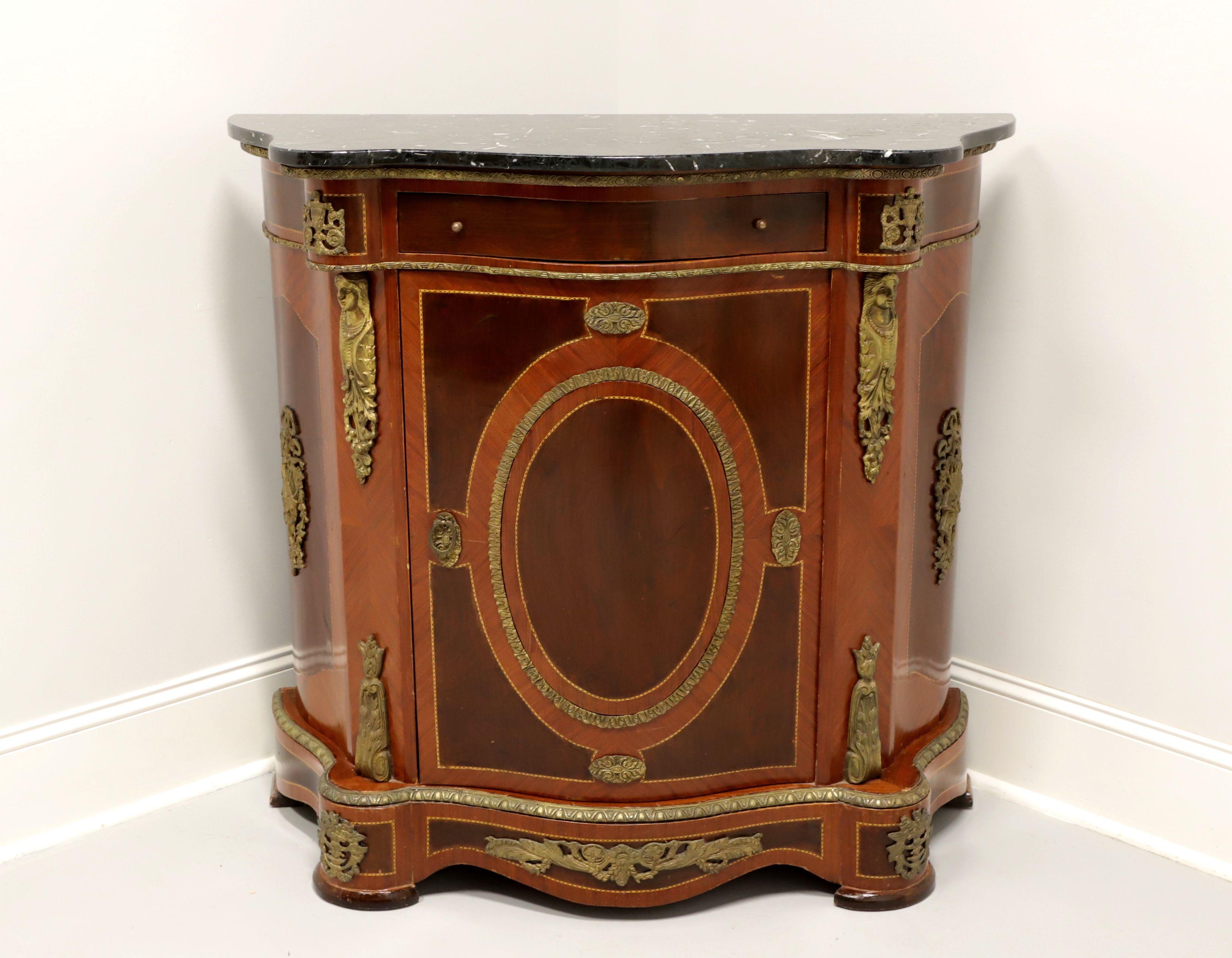 An antique marble top console cabinet in the Italian Neoclassical style, unbranded. Mahogany and veneers, marble top, marquetry designs and brass ormolu mounts. Features one drawer over a lower one door cabinet revealing interior storage with one