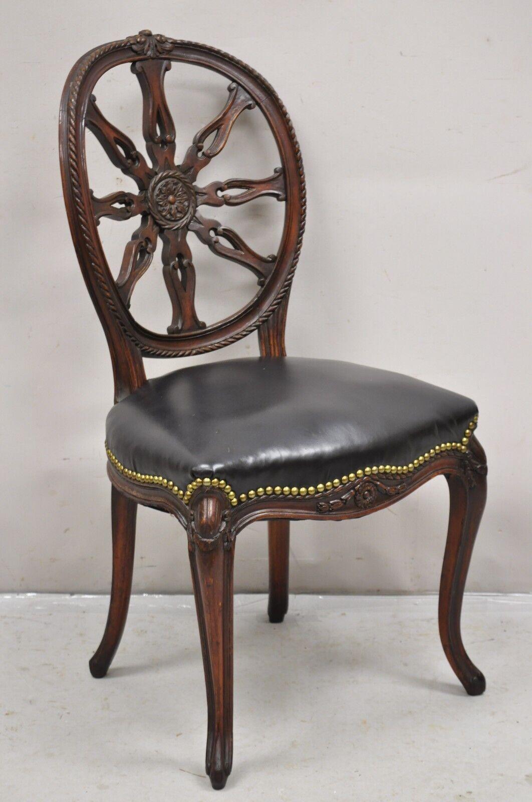 Antique Italian Neoclassical Style Pinwheel Carved Mahogany Dining Chairs - Set of 4. Item features a distressed finish, solid wood frames, pinwheel carved backs, cabriole legs. One chair with original distressed black leather seat and the other