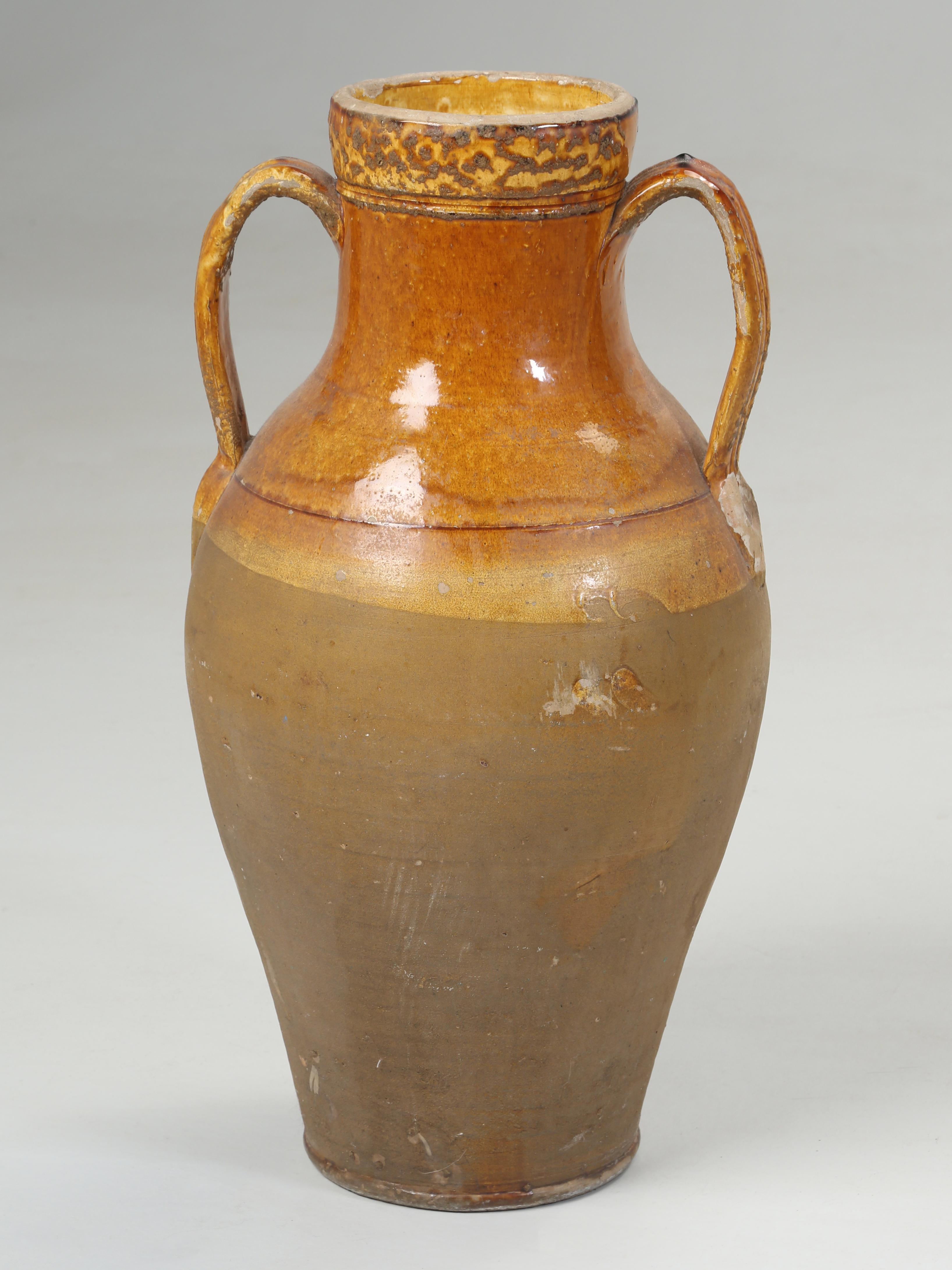 In the trade, we commonly call these an Olive Oil Jar, but are actually an amphora, which is a type of container of a specific shape and dimension, which began in the Neolithic Period, which ran from approximately 9000BC to 3500BC. Amphorae vessels