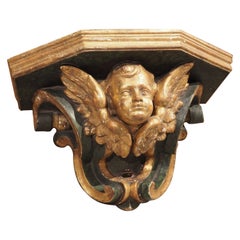 Antike italienische Cherub-Wandhalterung aus lackiertem und vergoldetem Holz, um 1850