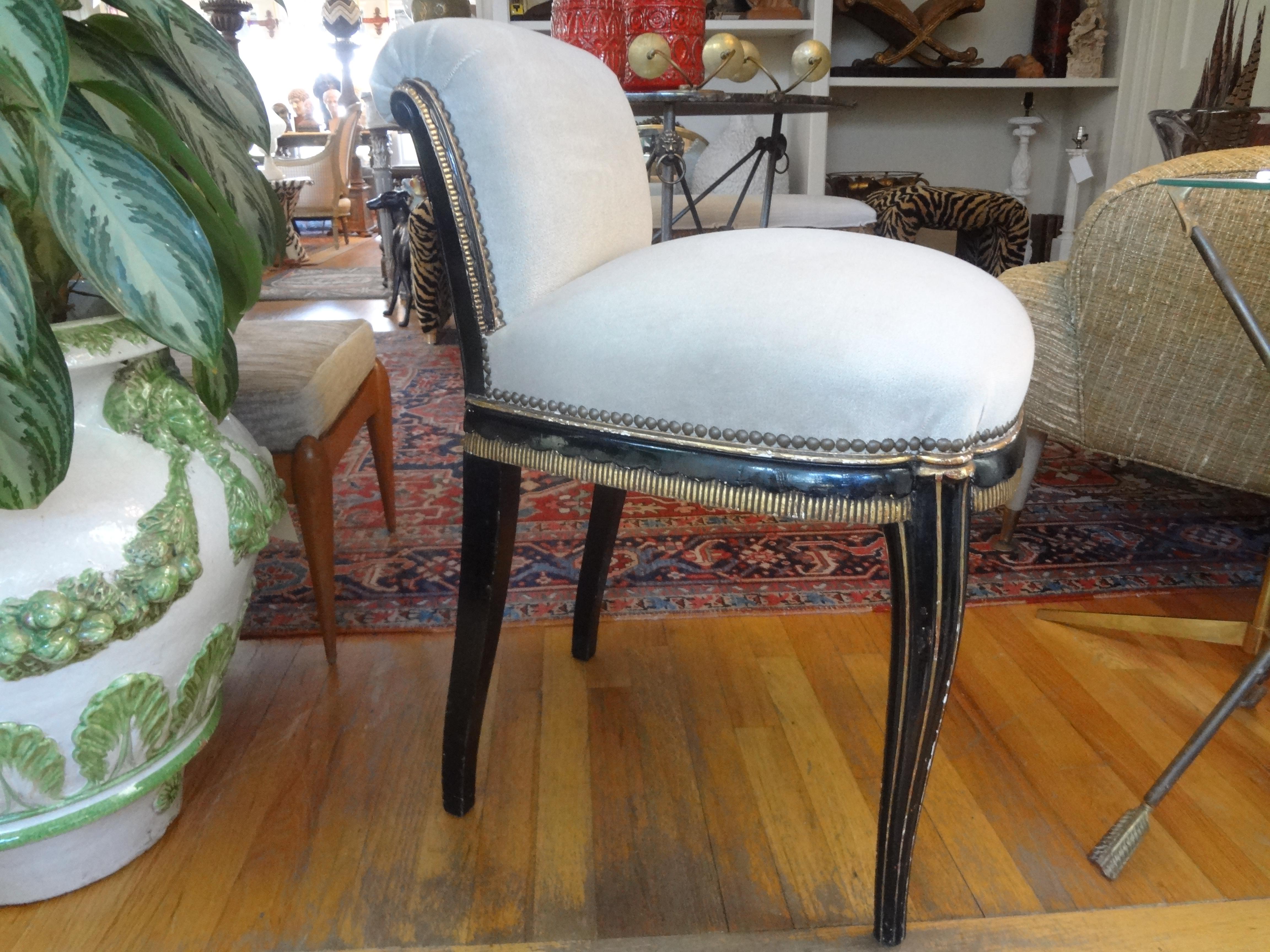 Stunning antique Italian Art Deco painted and giltwood slipper chair or vanity chair. This beautiful and comfortable chair, stool or bench has been professionally upholstered in high quality neutral taupe velvet fabric with brass nailhead detail.