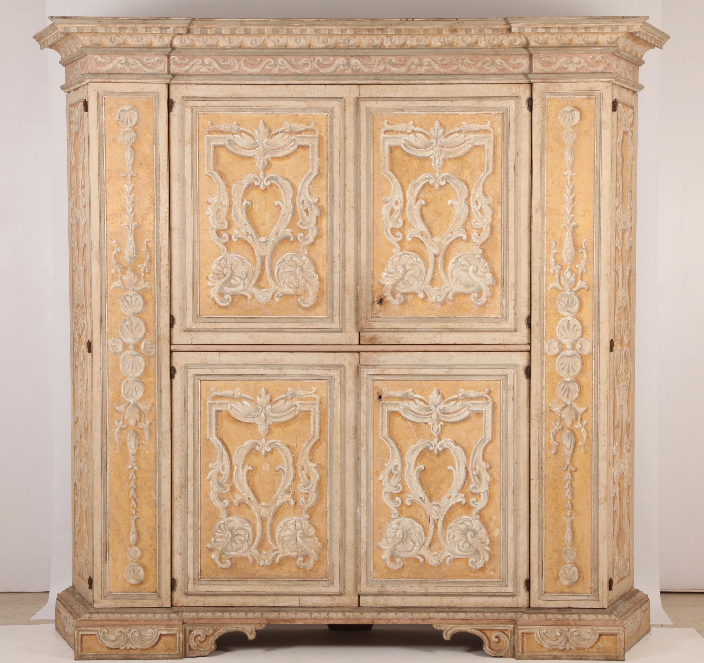 Large cabinet (linen press or dinning room) painted in the Florentine style.
With tones of Ochre and off white, fitted with with Shelves all around.
Can be dismantled for transportation.

 