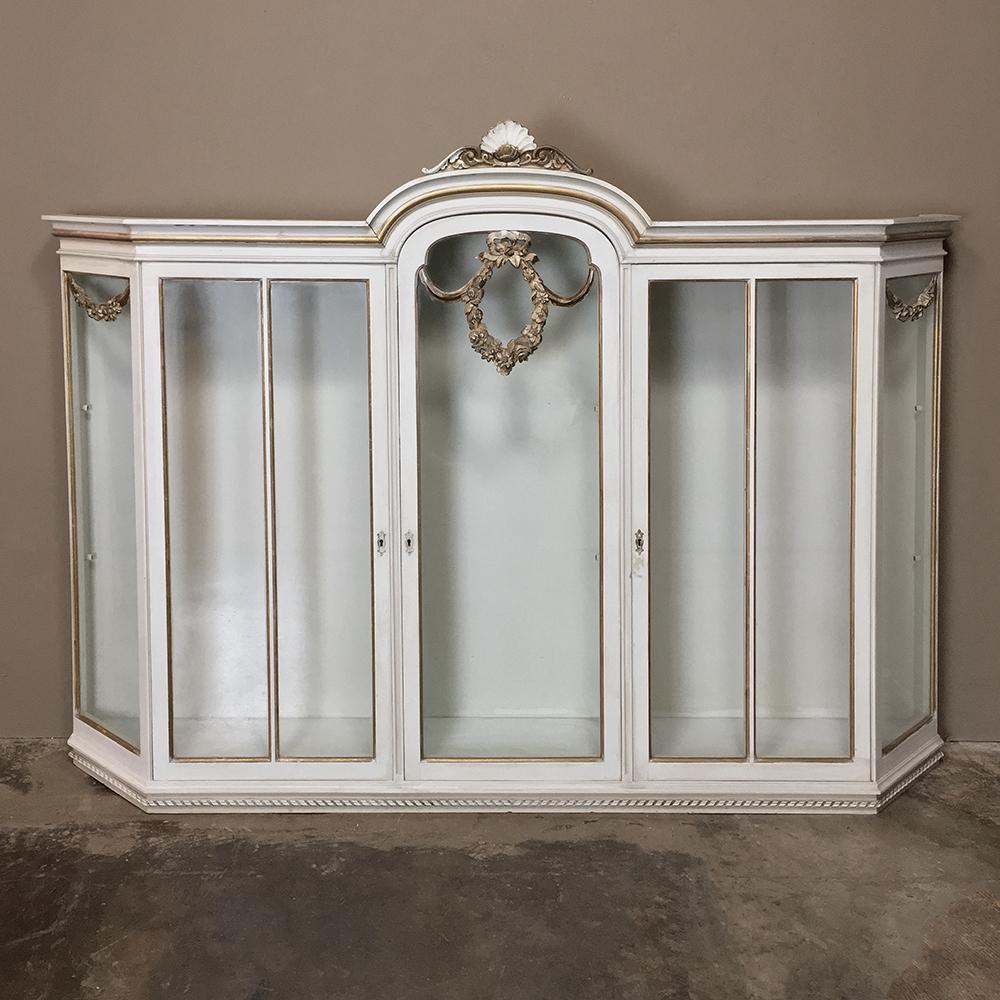 Antique Italian Painted Louis XVI Wall Vitrine ~ Display Case is a wonderful neoclassical design that includes beveled sides, three doors and seven glazed panes to allow you to not only show off your prized possessions, but also to create a timeless