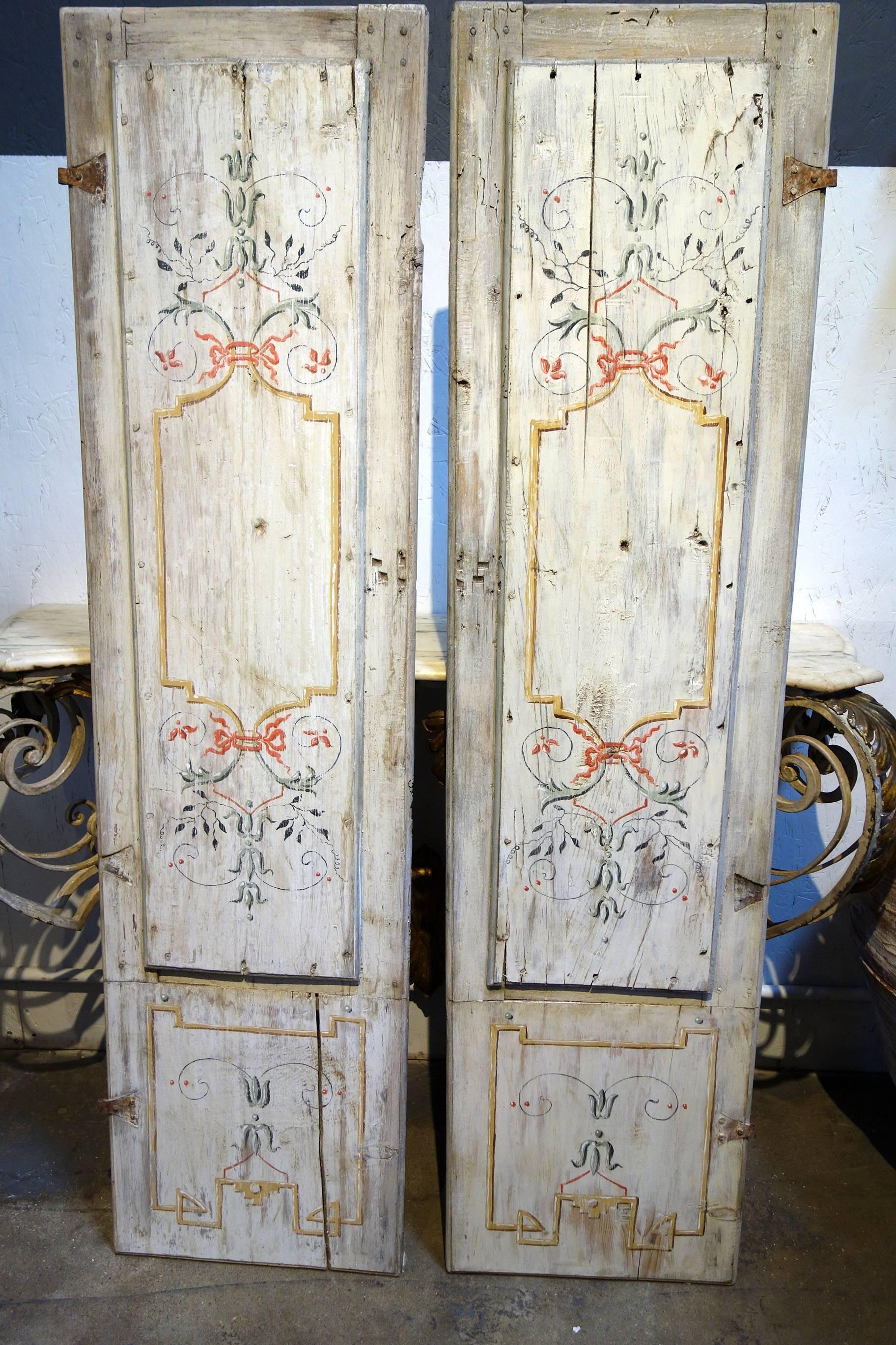 Lovely pair of hand-painted door panels with iron hinges. Well preserved old structure. Early 19th century.

Measures: 64” H, 16.75” W each panel, paired 33” W, 1.5” D.
