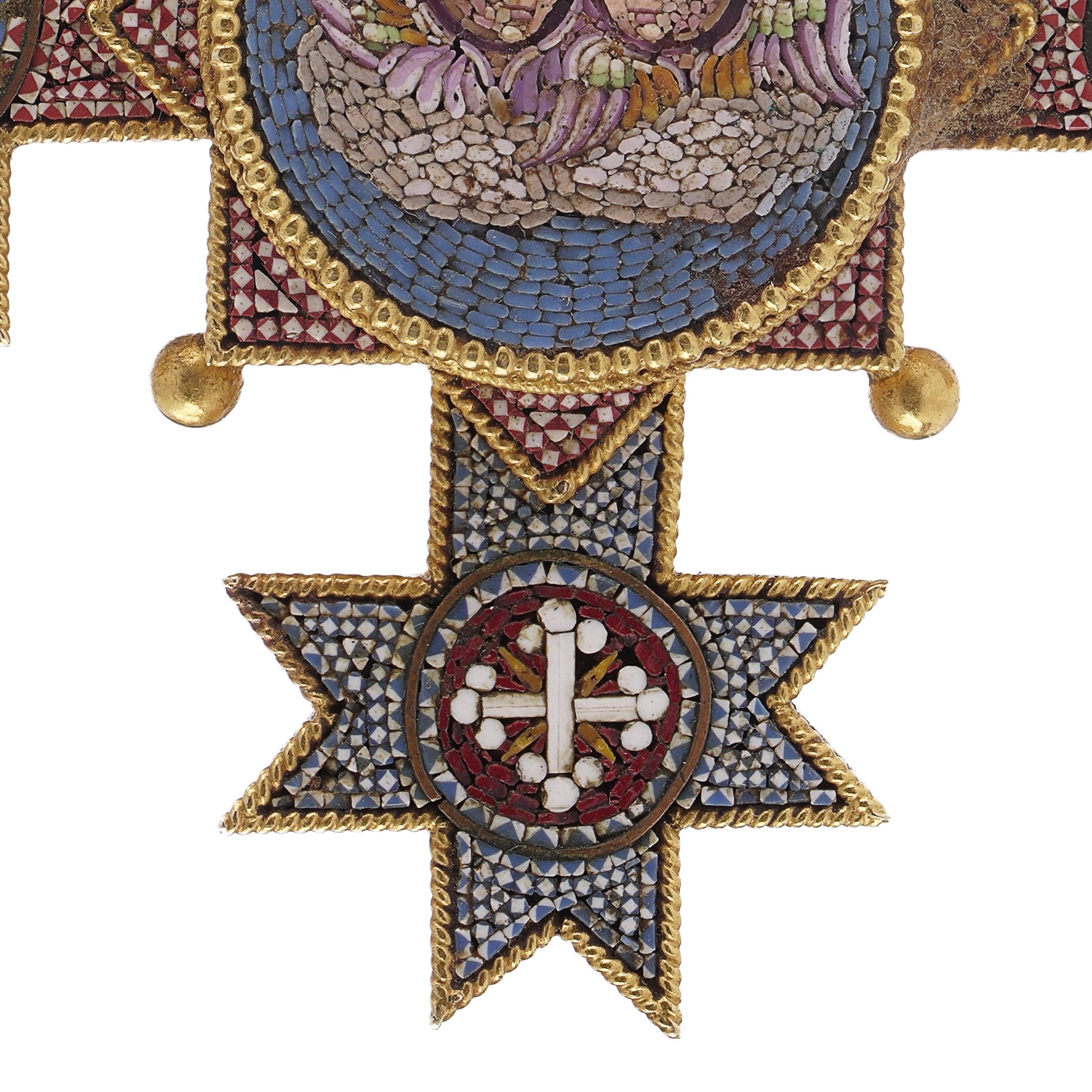 A rare and historically significant mid-19th century Italian cross pendant, meticulously crafted in 22 karat yellow gold and intricately decorated with fine micro mosaic work. Made in the Papal workshops of the Vatican, the pendant is stamped with