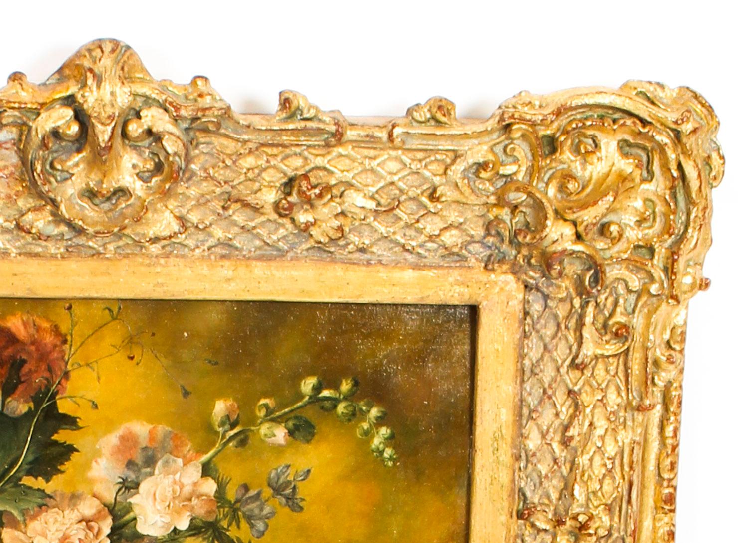 A beautiful Antique Italian parcel-gilt Trumeau mirror, circa 1860 in date.

The mirror features a top panel with a carved acanthus carved crest and diamond running pattern, framing a beautiful painting depicting a still life of bouquet summer