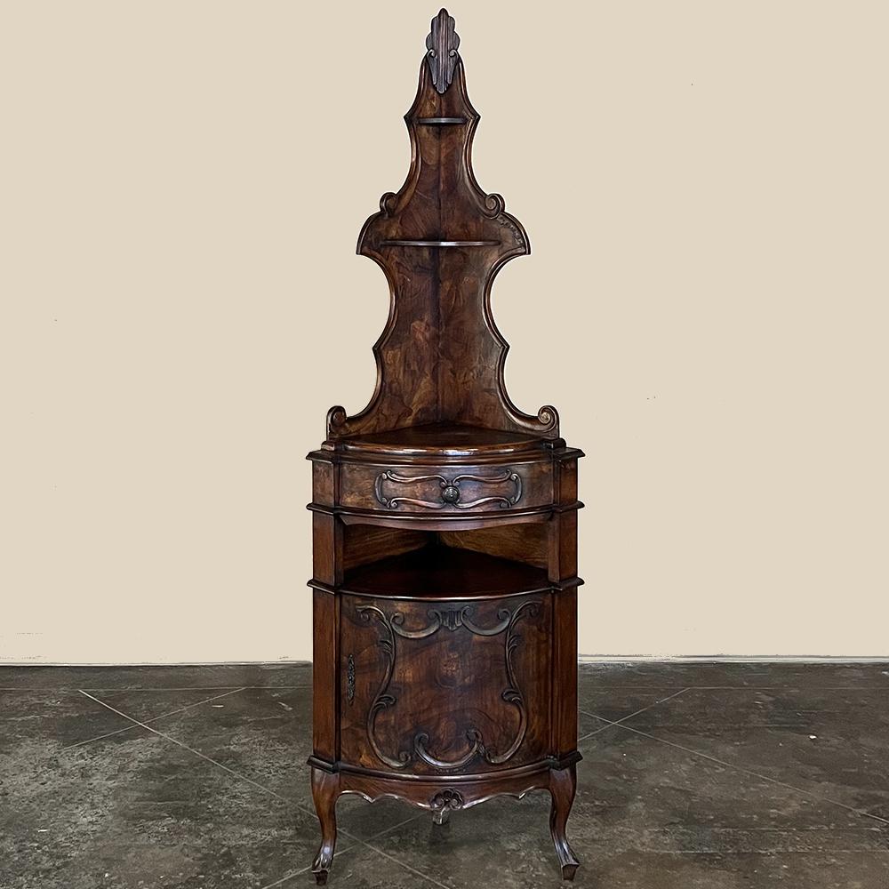 Antique Italian Piemontese walnut corner cabinet will make a charming addition to any room, and both decorate and make useful an otherwise unused corner. Fanciful scrollwork defines the upper tier, which is removable for extra-easy transport, with a