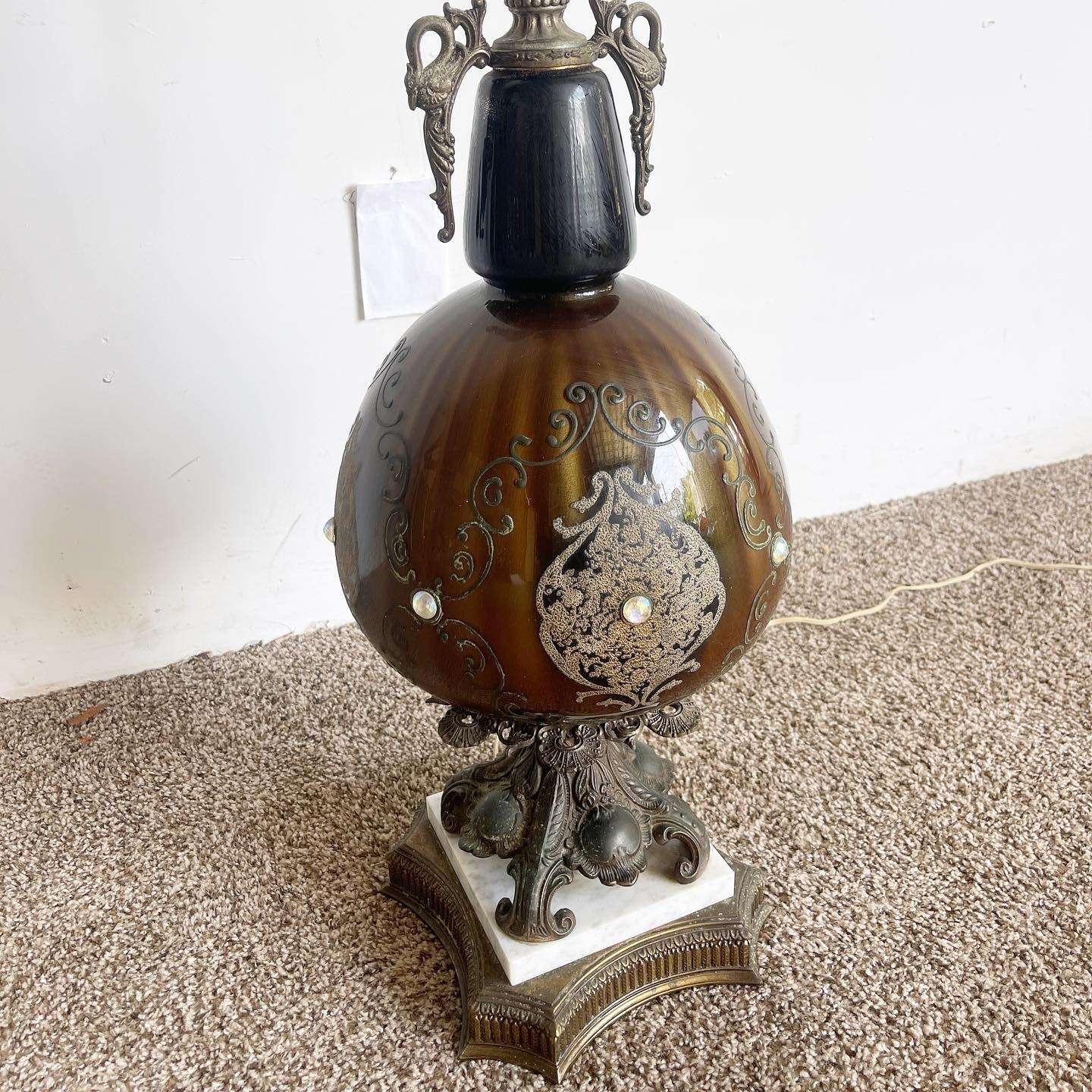 Illuminate your space with the exquisite beauty of this antique Italian table lamp. Crafted with porcelain adorned with rhinestones and complemented by a luxurious marble base, this lamp showcases the perfect blend of elegance and timeless charm,
