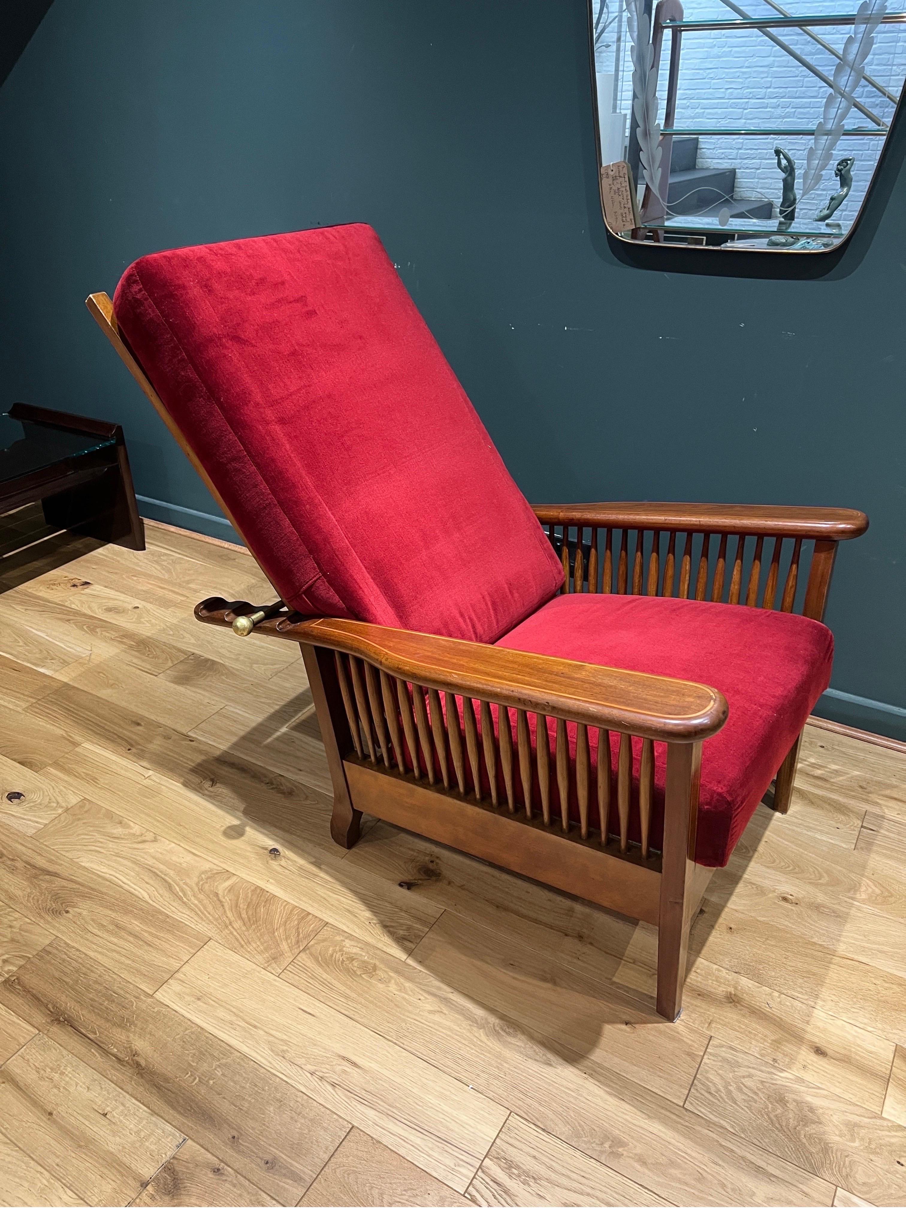 A fine Italian antiques solid walnut reclining campaign armchair. The back seat is supported by an adjustable single solid brass bar allowing it to alternate the recline into four different positions. Both cushions are removable and the back seat