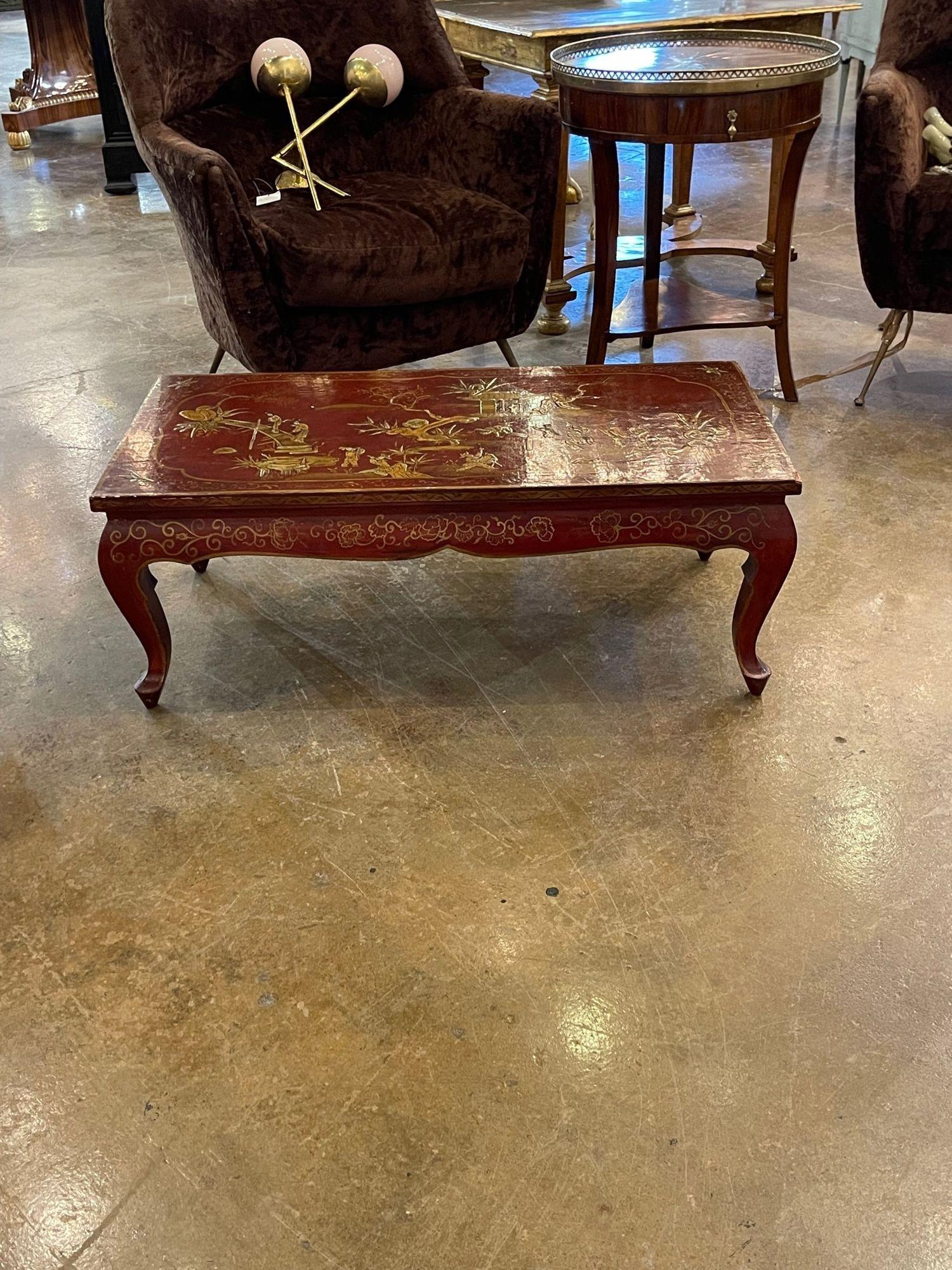 Beautiful antique Italian red Chinoiserie decorated coffee table. Very fine hand painted Asian designs on a red lacquered base. A true work of art!
