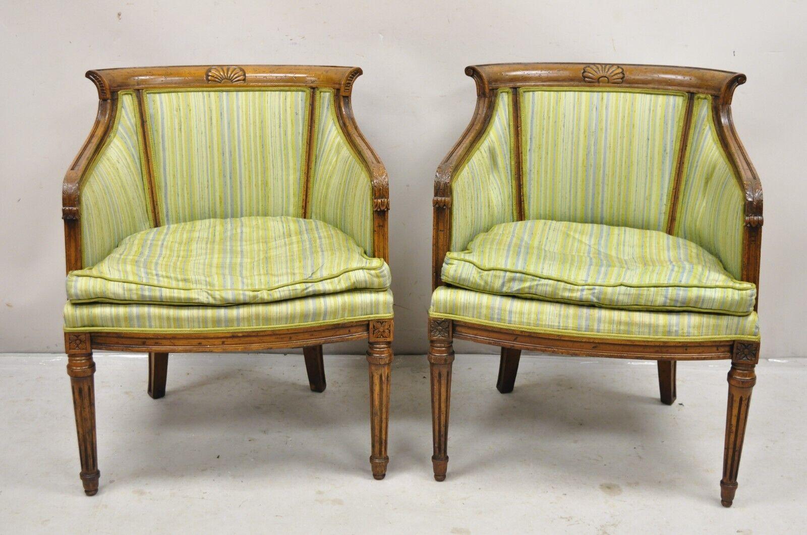 Antique Italian Regency Distressed Carved Walnut Barrel Back Club Chairs - a Pair. Item features solid carved walnut frames, distressed finish, shapely barrel backs. Slight variation in carving details and color between the chairs with examples