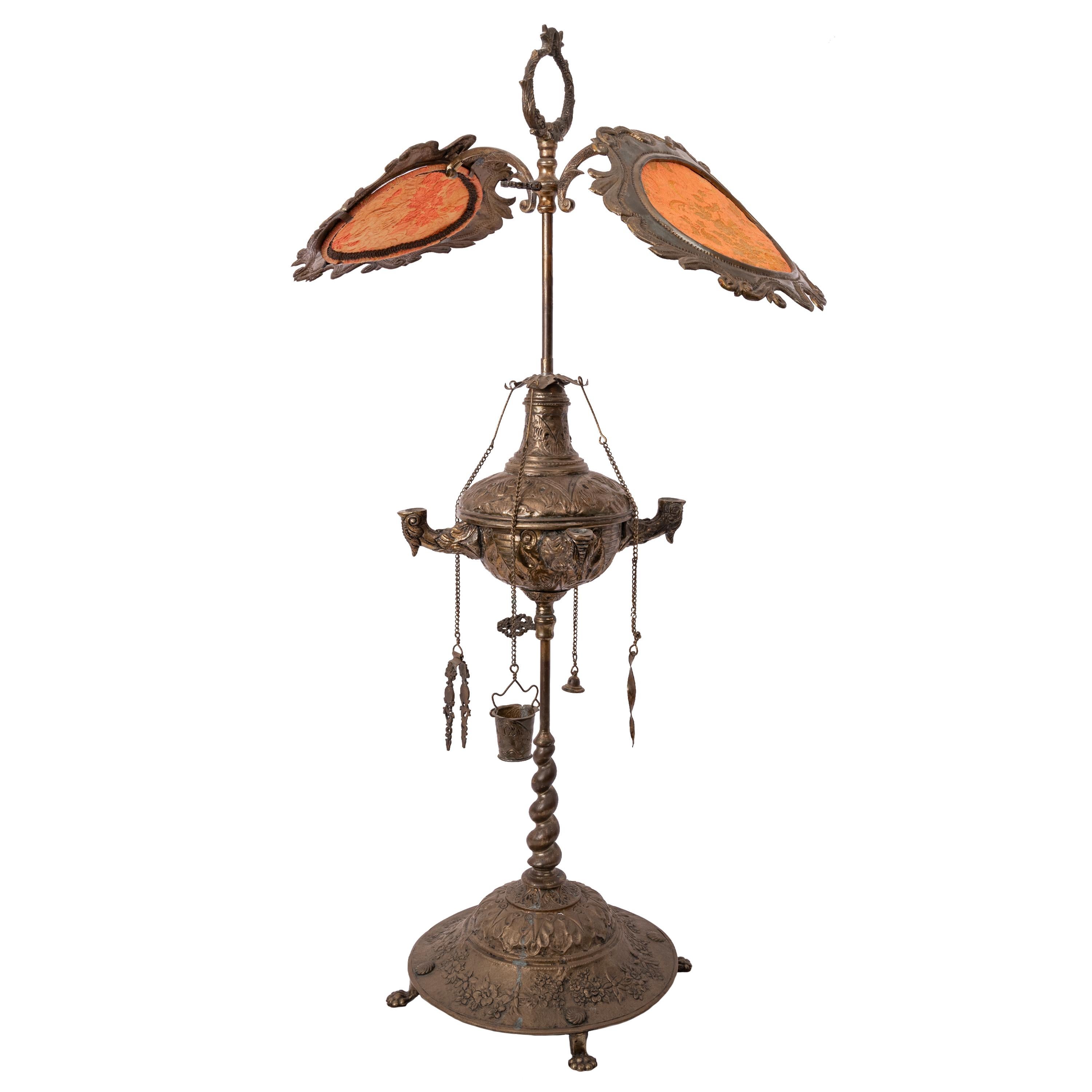 A good 19th century Italian 'Florentine' or 'Lucerne' 4 burner brass oil lamp, in the Renaissance Revival manner, circa 1860.
Designed to burn whale oil which is placed into a reservoir with a lift up cover that would have four wicks, one to each