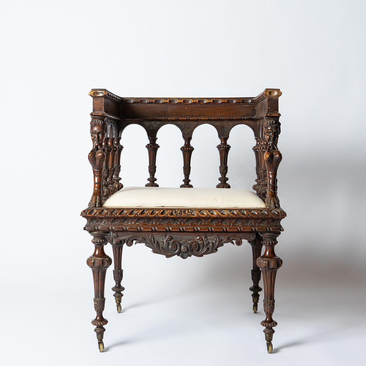 Antique walnut chair with figural carving
Probably Northern Italian in origin and carved in the Italian Renaissance style.
 
An unusually square shape profusely carved with naturalistic carvings and decorative turned spindles with grotesques or