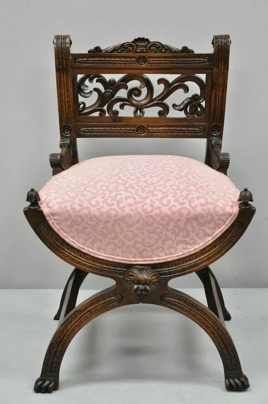 Antique Italian Renaissance Carved Walnut Figural Northwind Face Curule Side Chair. Item features a carved face to base, pierce carved scrollwork back, paw feet, solid wood construction, beautiful wood grain, finely carved details, very nice antique