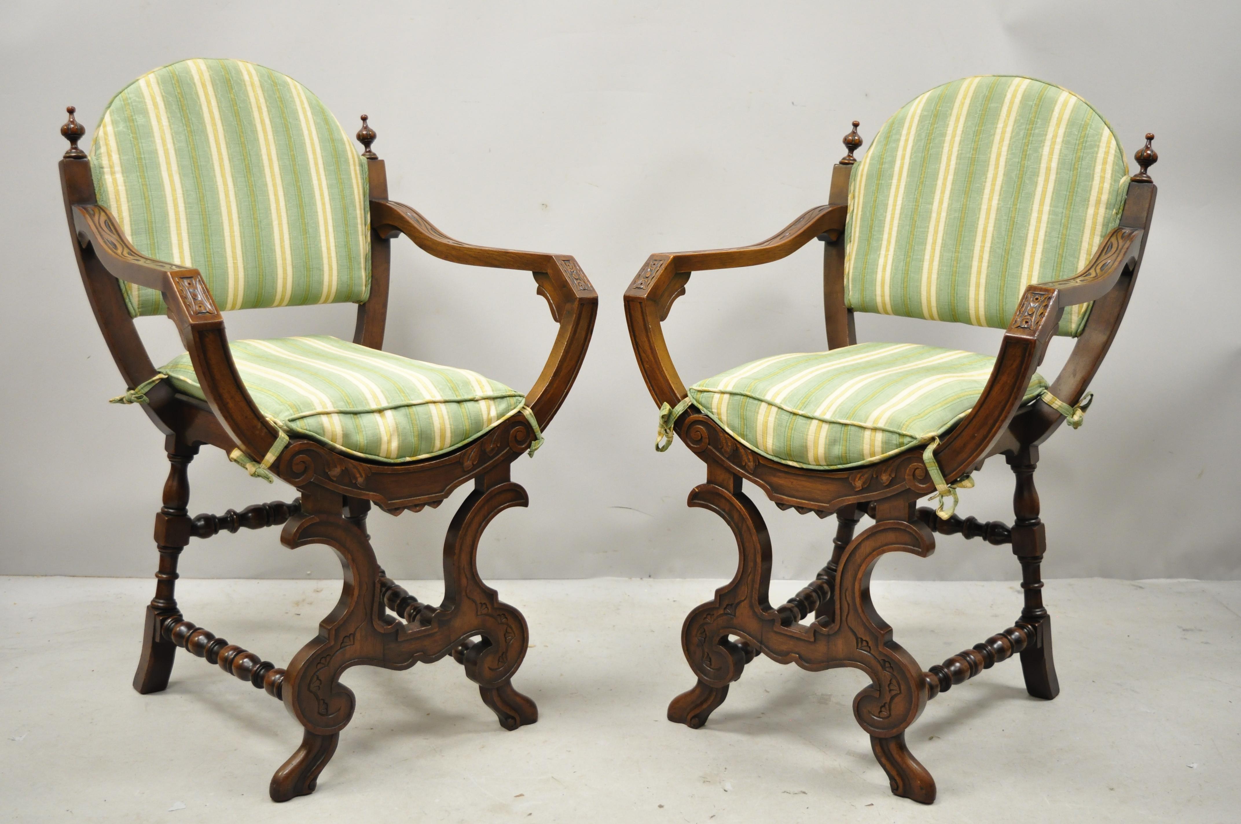 Pair of antique Italian Renaissance carved walnut Savonarola Throne armchairs. Item features turn carved stretcher supports, loose seat cushion, solid wood construction, nicely carved details, very nice antique item, circa early 1900s. Measurements: