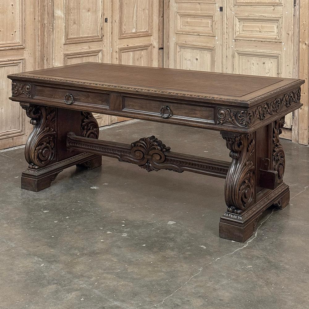 Antique Italian Renaissance Executive Desk with Faux Leather is the perfect choice for a timeless Old World decor.  Hand-carved in walnut, it features a beveled edge all around the newly installed faux leather top, with intricate foliate designs on