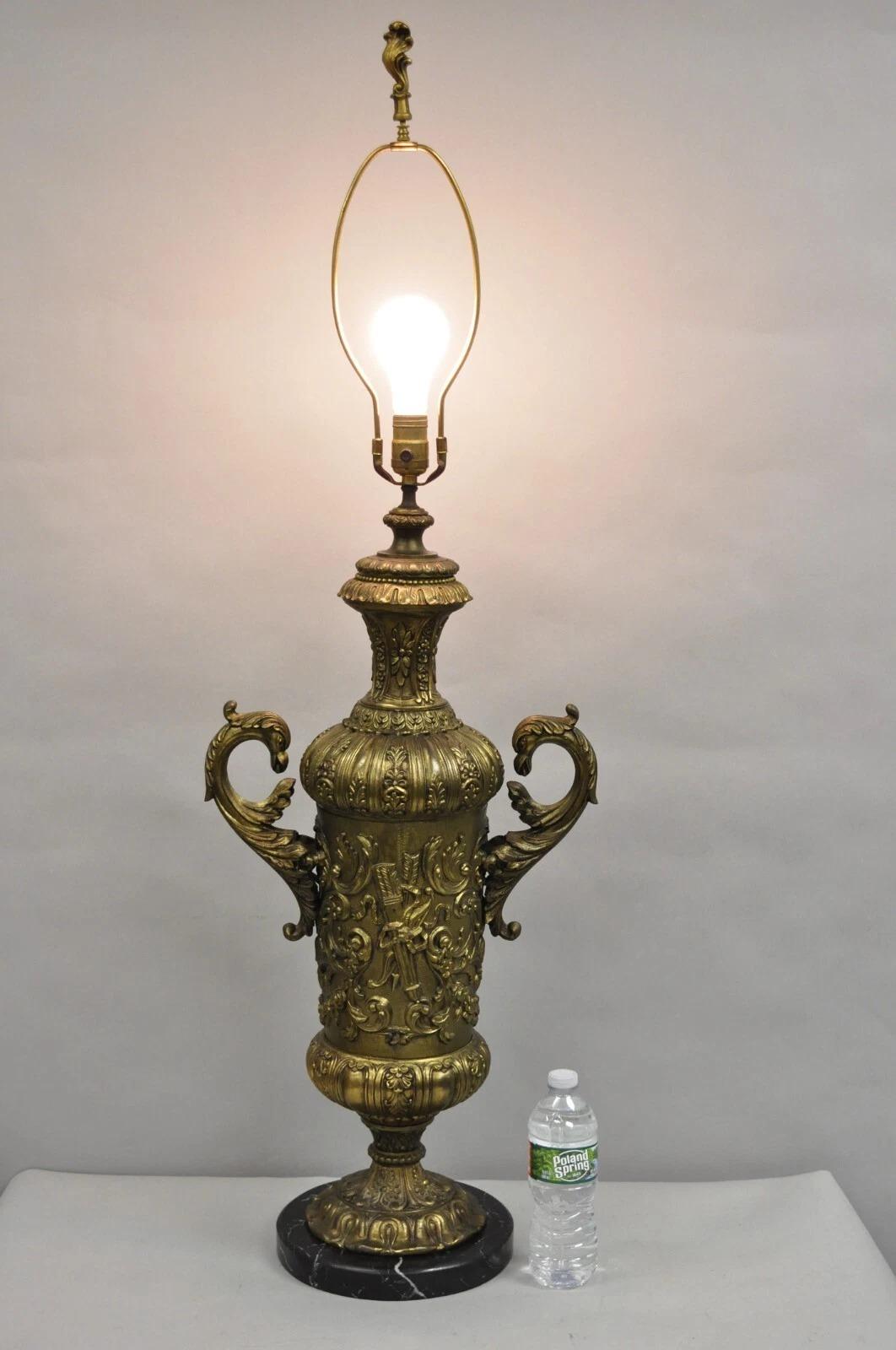Antique Italian Renaissance Gold Bronze Figural Twin Swan Handles Urn Large Table Lamp. Item features a round black marble base, arrow and scrollwork detail and weighs approximately 30 lbs. Circa Early 20th Century. Measurements: 45.5