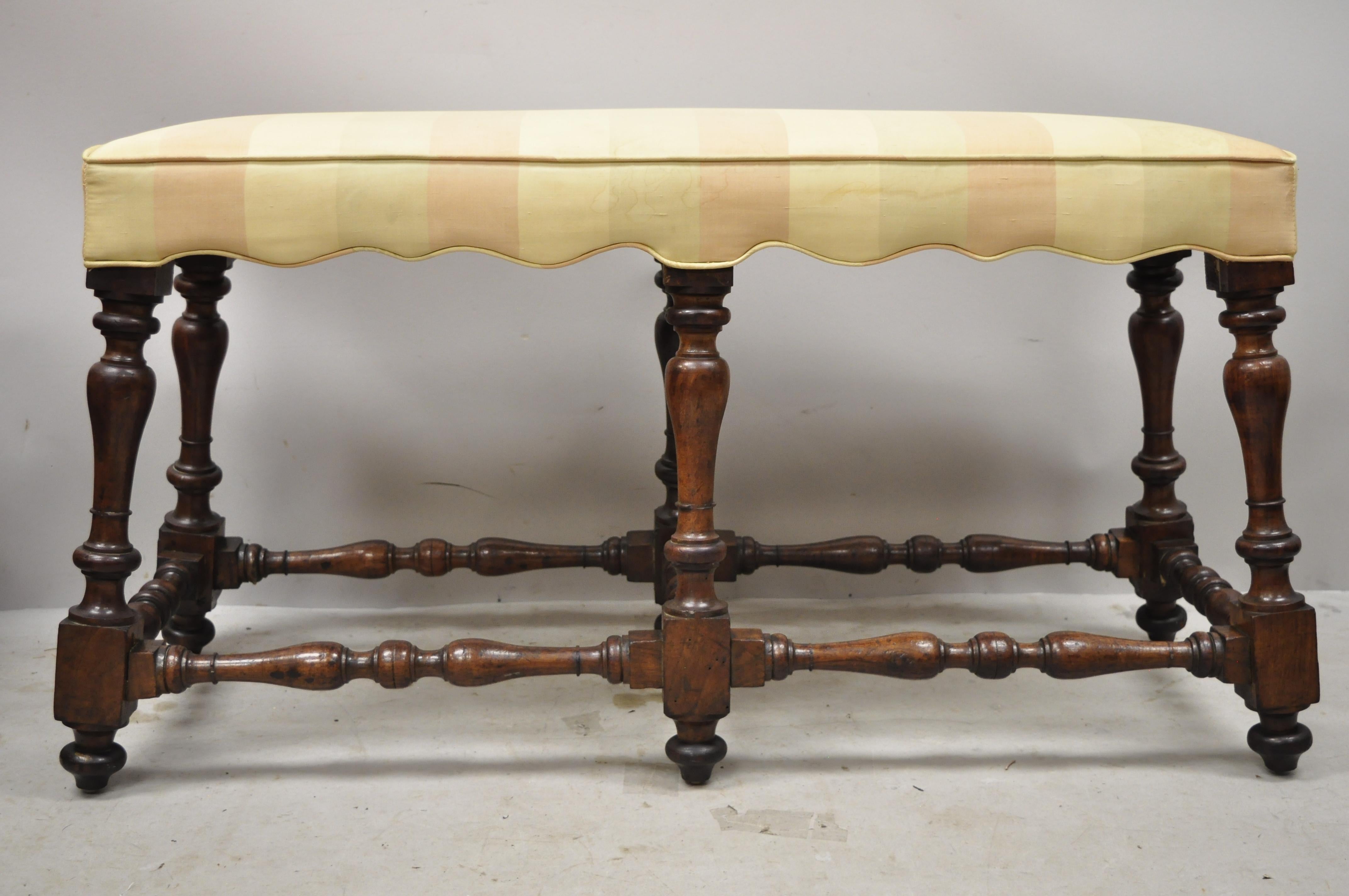 Antique Italian Renaissance Jacobean 6 turn carved walnut legs upholstered bench. Item features solid wood frame, beautiful wood grain, upholstered seat, nicely carved details, very nice antique item, great style and form, circa early 1900s.