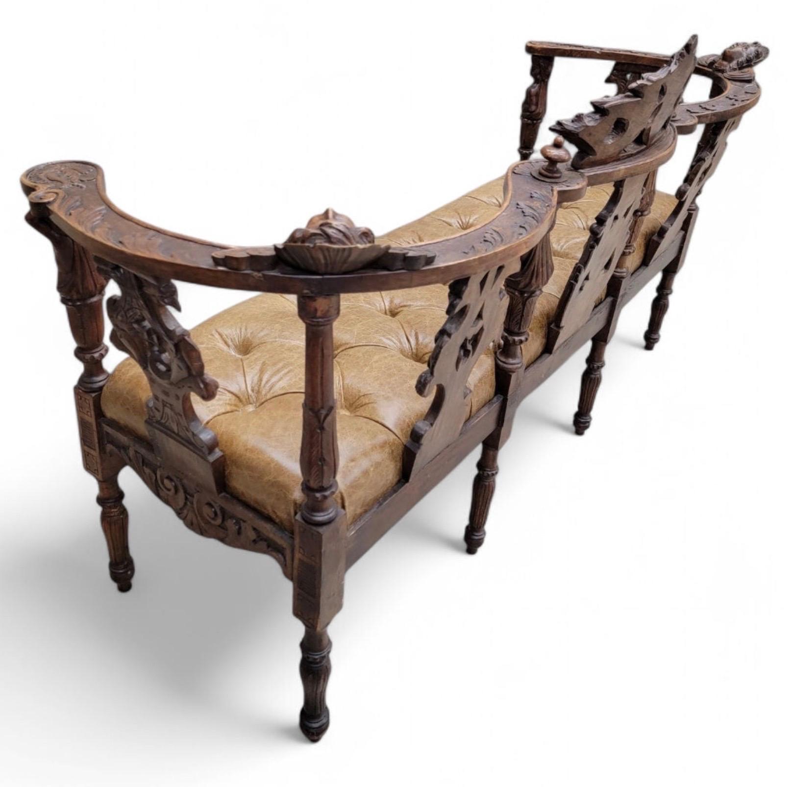 Antique Italian Renaissance Revival Carved Ornate Figural Walnut Button Tufted Parlor Bench Newly Reupholstered in Full Grain Italian Distressed Whiskey Leather

This exquisite bench is a stunning addition to any home. The intricate carvings and