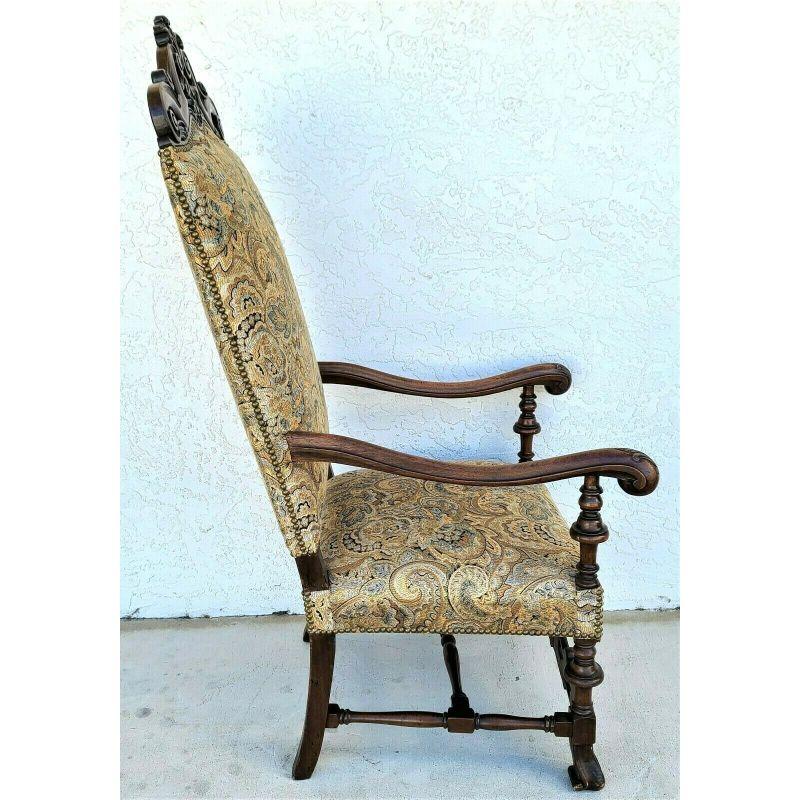 Offering one of our Recent Palm Beach Estate Fine Furniture Acquisitions of an 
Antique Italian Renaissance Revival style carved walnut throne chair.

With wonderful carvings and brass nail head trim

Approximate measurements in Inches:
55