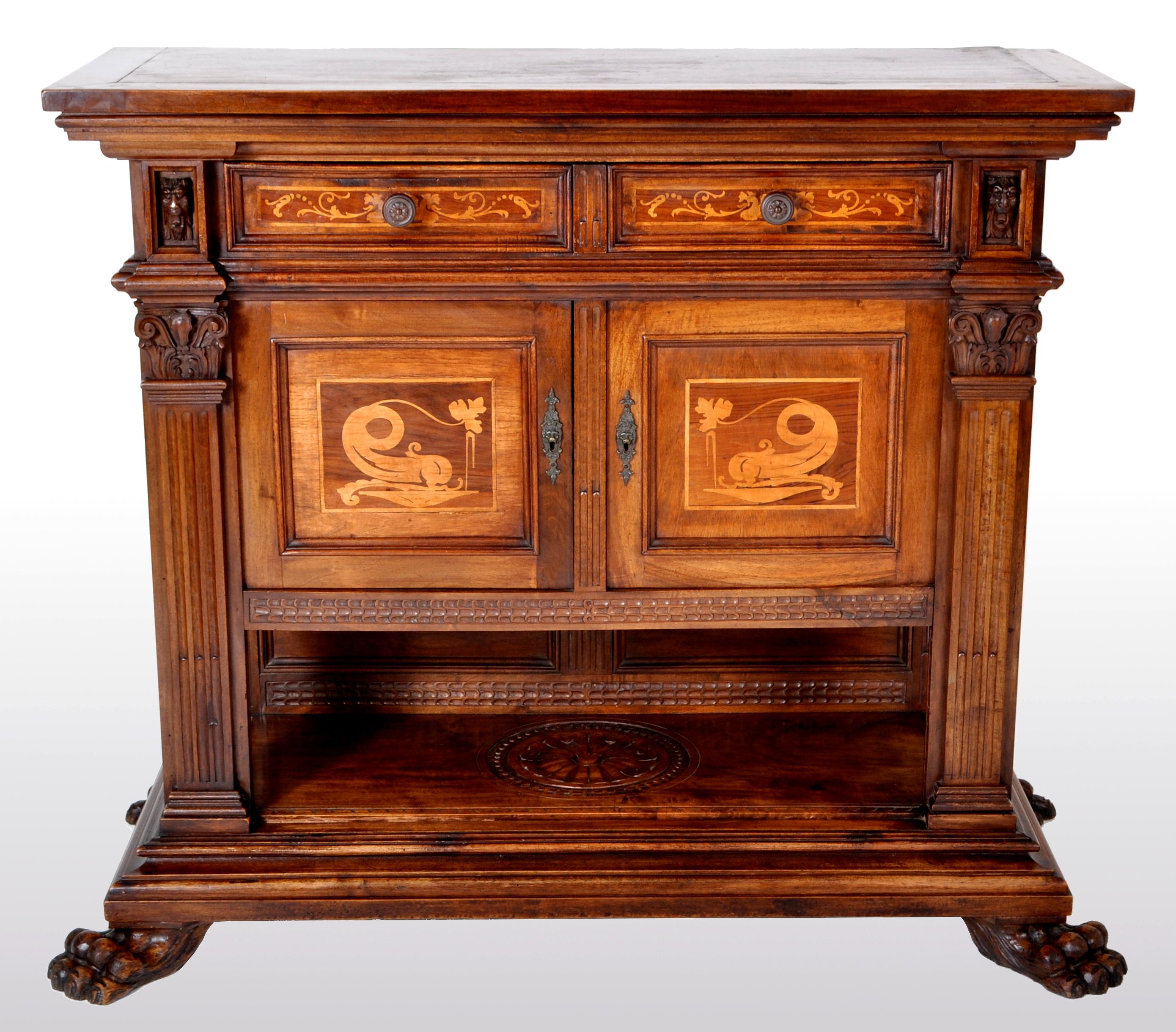Antique Italian Renaissance Revival walnut marquetry sideboard / cabinet / server, circa 1880. The cabinet having a substantial stepped top and having two drawers below inlaid with floral marquetry and having turned handles. The drawers flanked by a