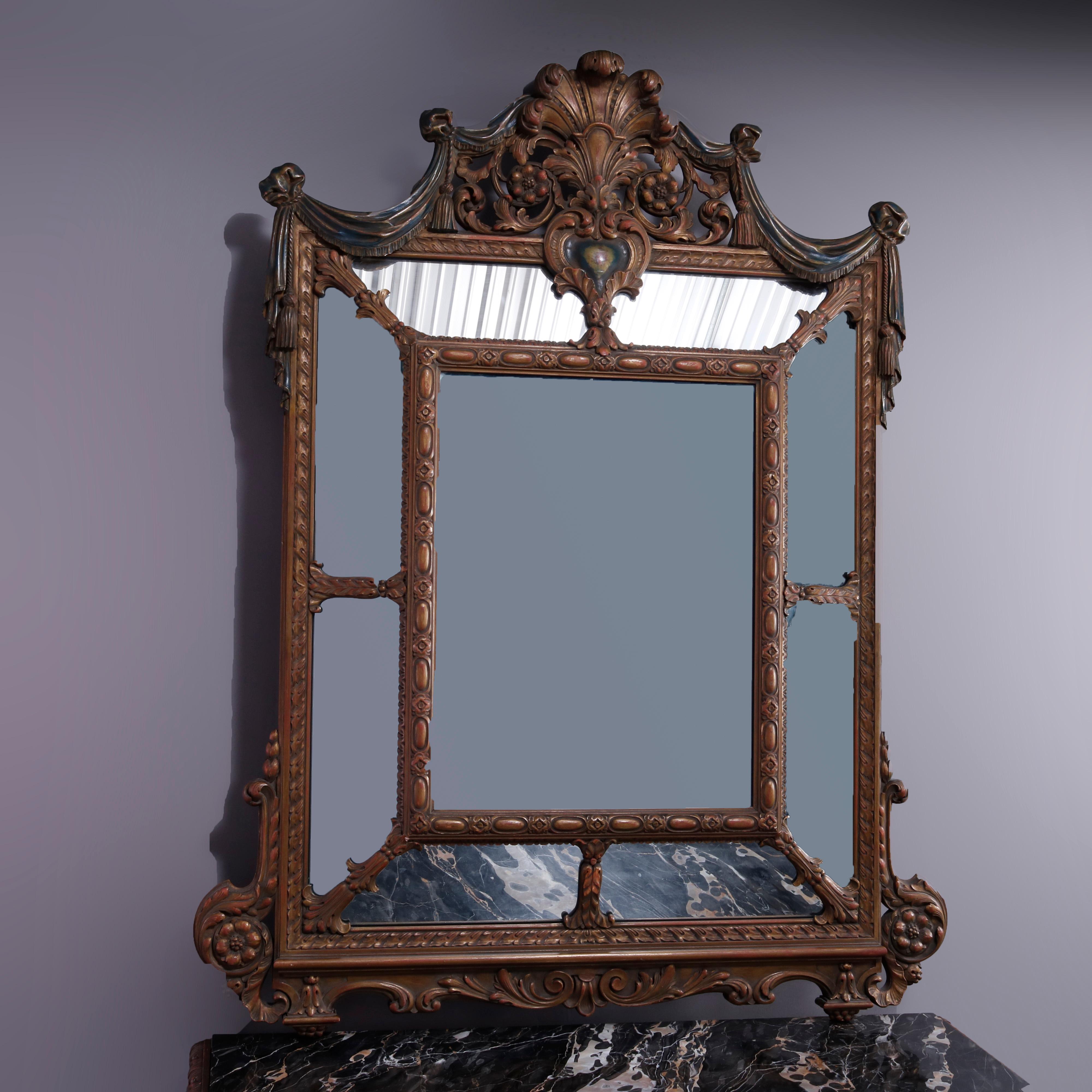 An antique Italian Renaissance style console set offers walnut construction with parclose wall mirror having carved shell and foliate crest over marble top table having deeply carved and pierced skirt raised on scroll form legs having x-stretcher