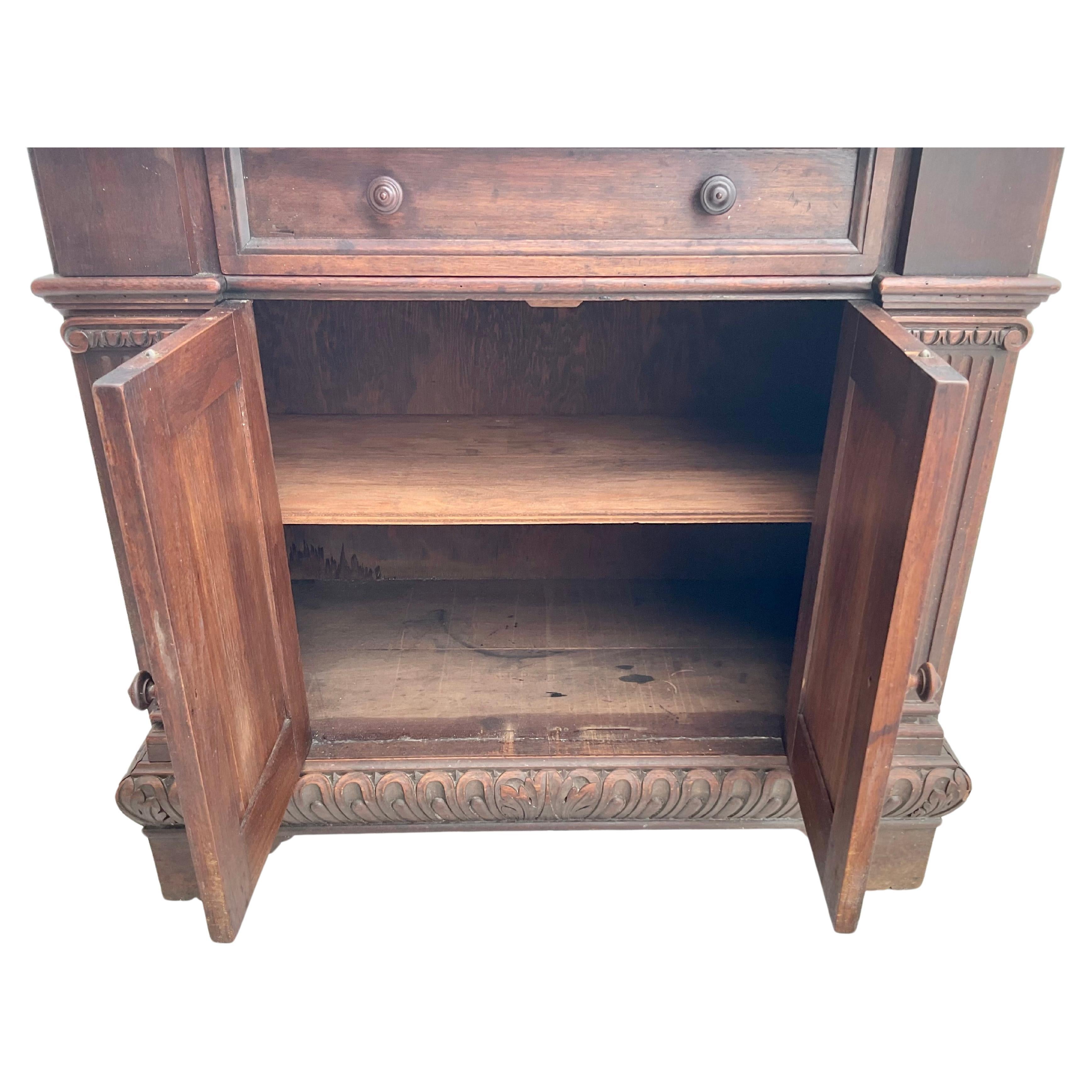 19th century Renaissance style carved walnut cabinet or server with lower compartment and 1 drawer. Fluted columns on both sides, thumb molded top edge and apron, giving this piece a great architectural design. Warm pleasing patina.