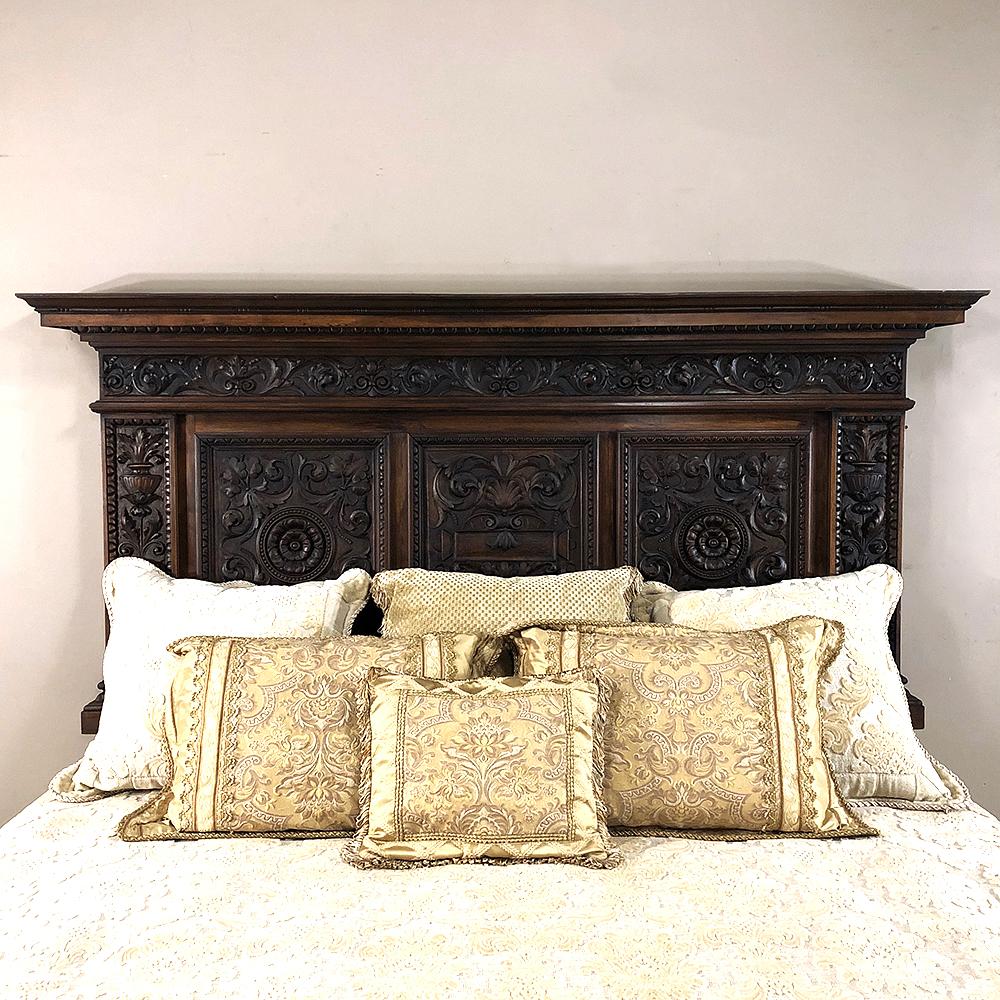 Antique Italian Renaissance walnut headboard is designed to mount onto the wall, and easily accommodates a queen or king size bed! Hand carved with intricate relief work worthy of the most talented sculptor, the sumptuous natural beauty of the wood