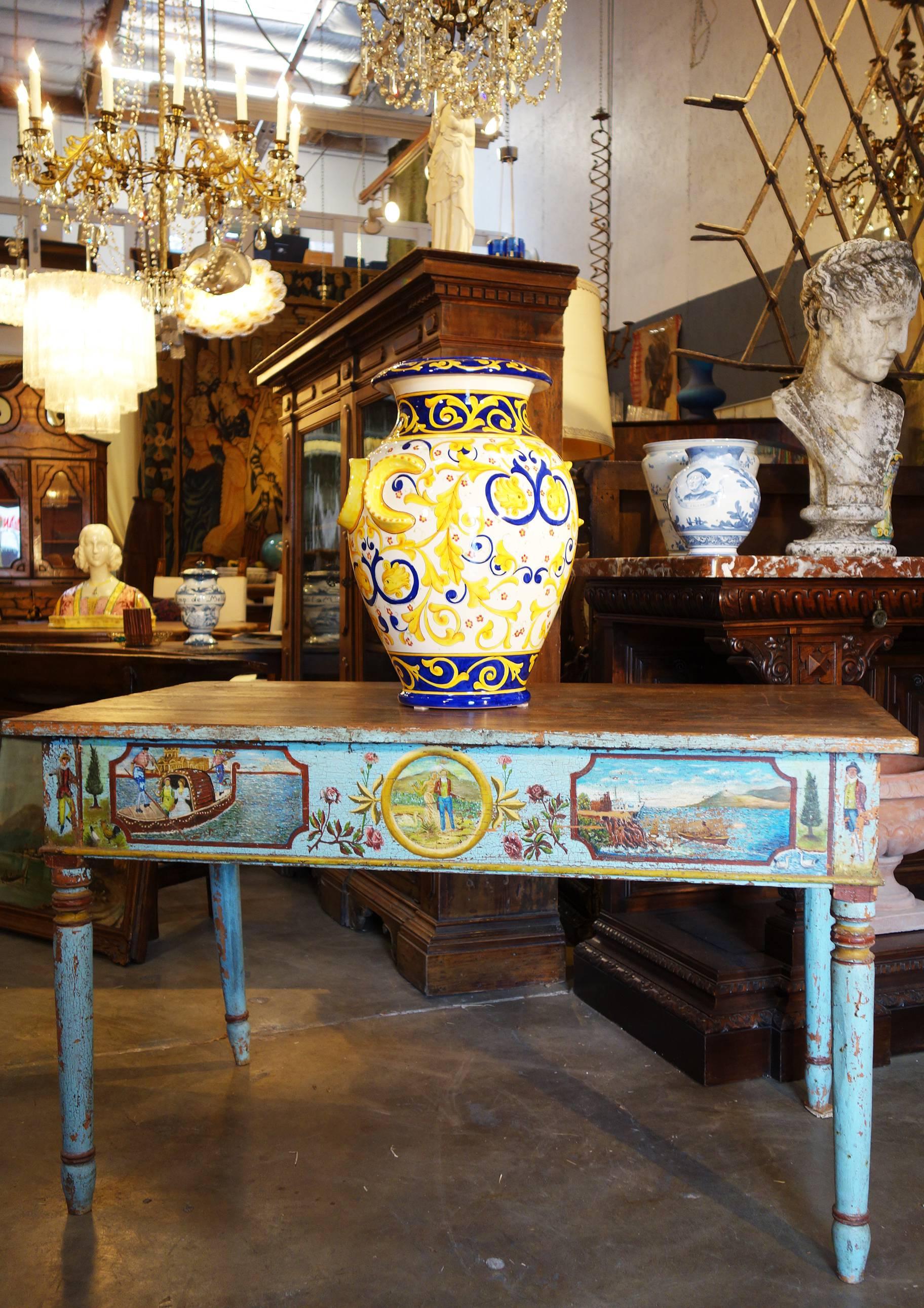Lovely reproduction of Classic Renaissance Revival theme, expertly handcrafted and hand-painted Majolica glaze over terra cotta. 
Mediterranean blue & golden yellow color theme. Made in Italy.
Limited edition, exclusively produced for Bellini's