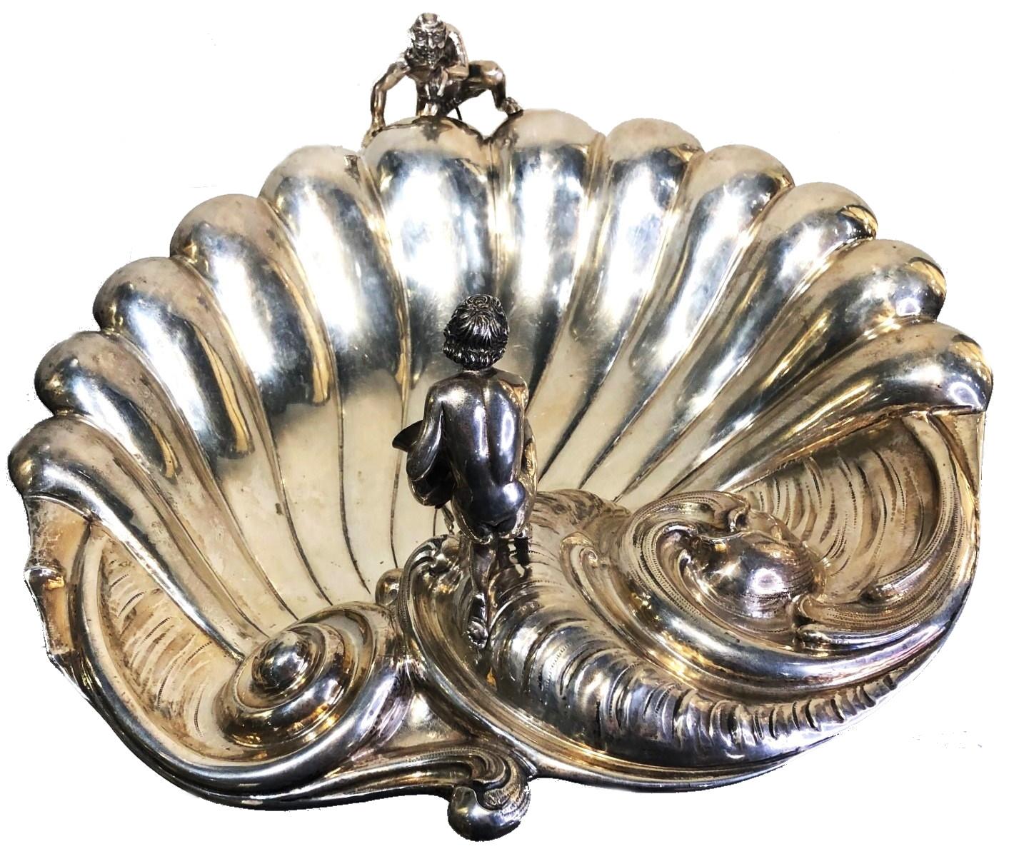 Rococo Revival
Antique Sculptural Centerpiece
800° Silver 
Italy, ca. 1880s

DIMENSIONS
Height: 7.75 inches            Width: 18.25 inches           Depth: 16.75 inches

WEIGHT
88oz (2,766g)

MARKINGS
Marked ‘800’ and two maker’s hallmarks
