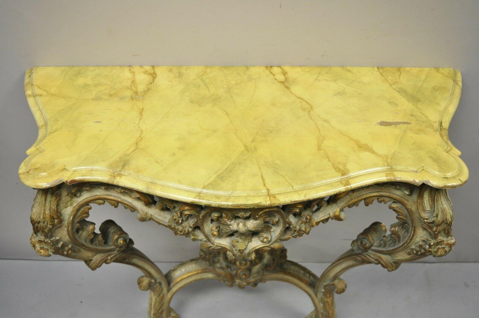 Antique Italian Rococo Carved Giltwood Wall Mount Console Hall Table. Item features a finely carved giltwood base, shapely wooden top with cream lacquer finish, very nice antique item, quality Italian craftsmanship, great style and form, does not