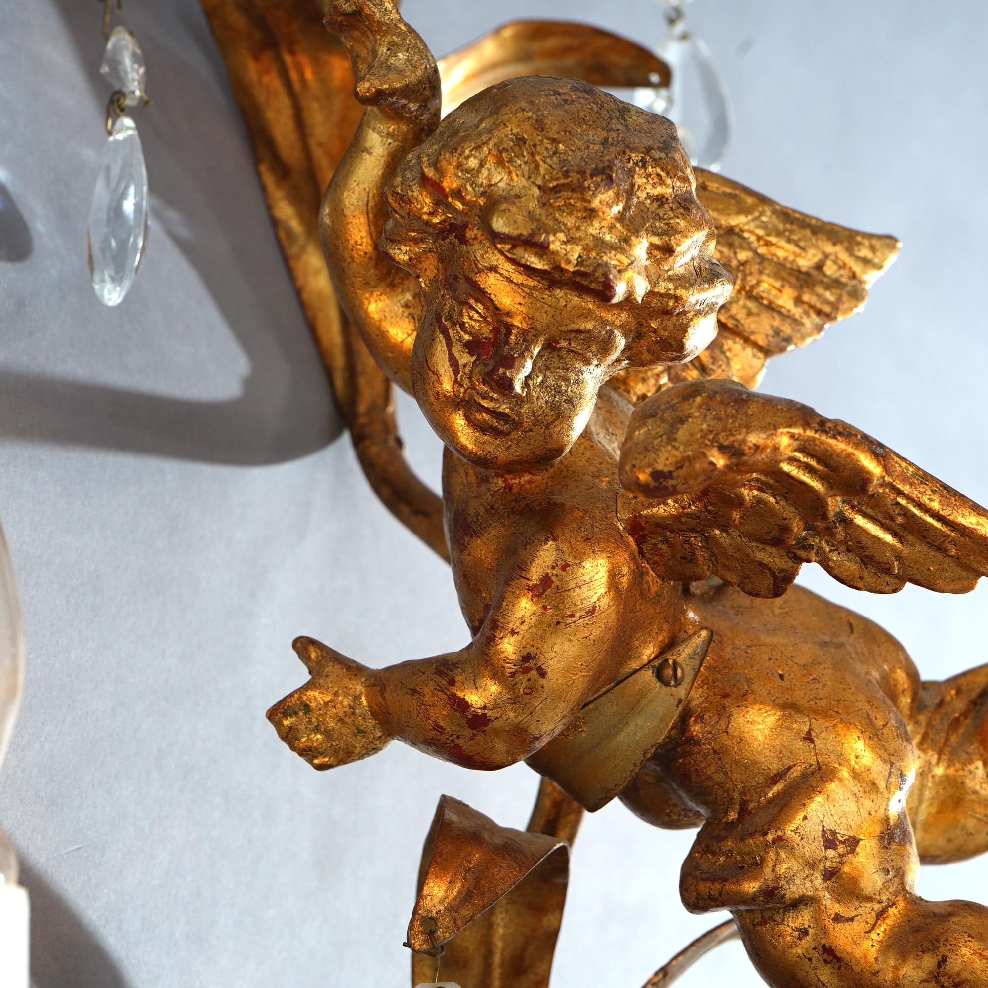 A antique Italian Rococo figural wall sconce offers gilt metal frame in foliate form with central cherub and candle lights, c1930

Measures - 28