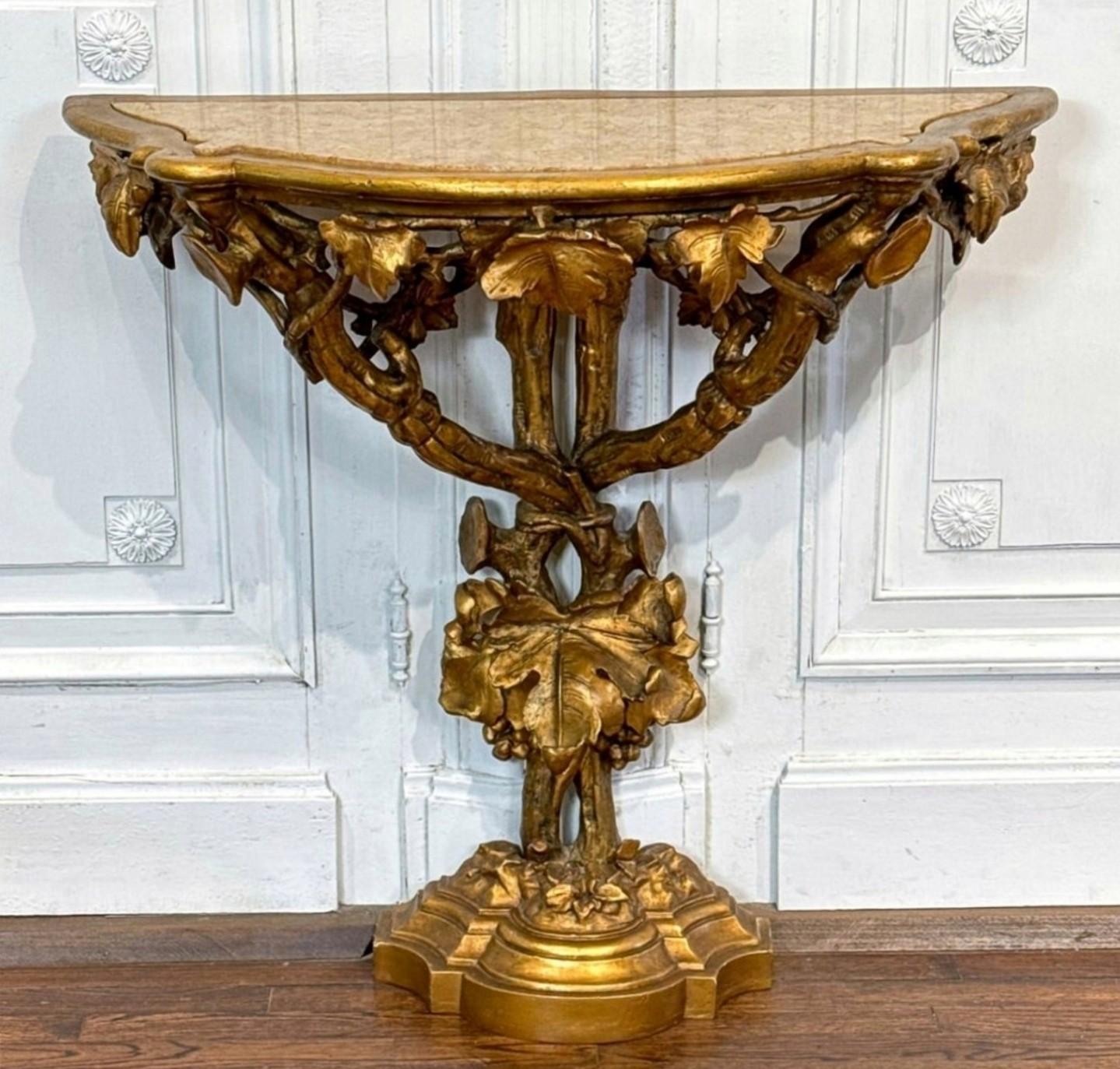 A stunning Italian Baroque elaborately carved gilt wood marble top console table, circa 1870.

Italy, late 19th century, hand-crafted in opulent and luxurious Rococo Revival taste, exceptionally executed sculptural naturalistic form, having an inset