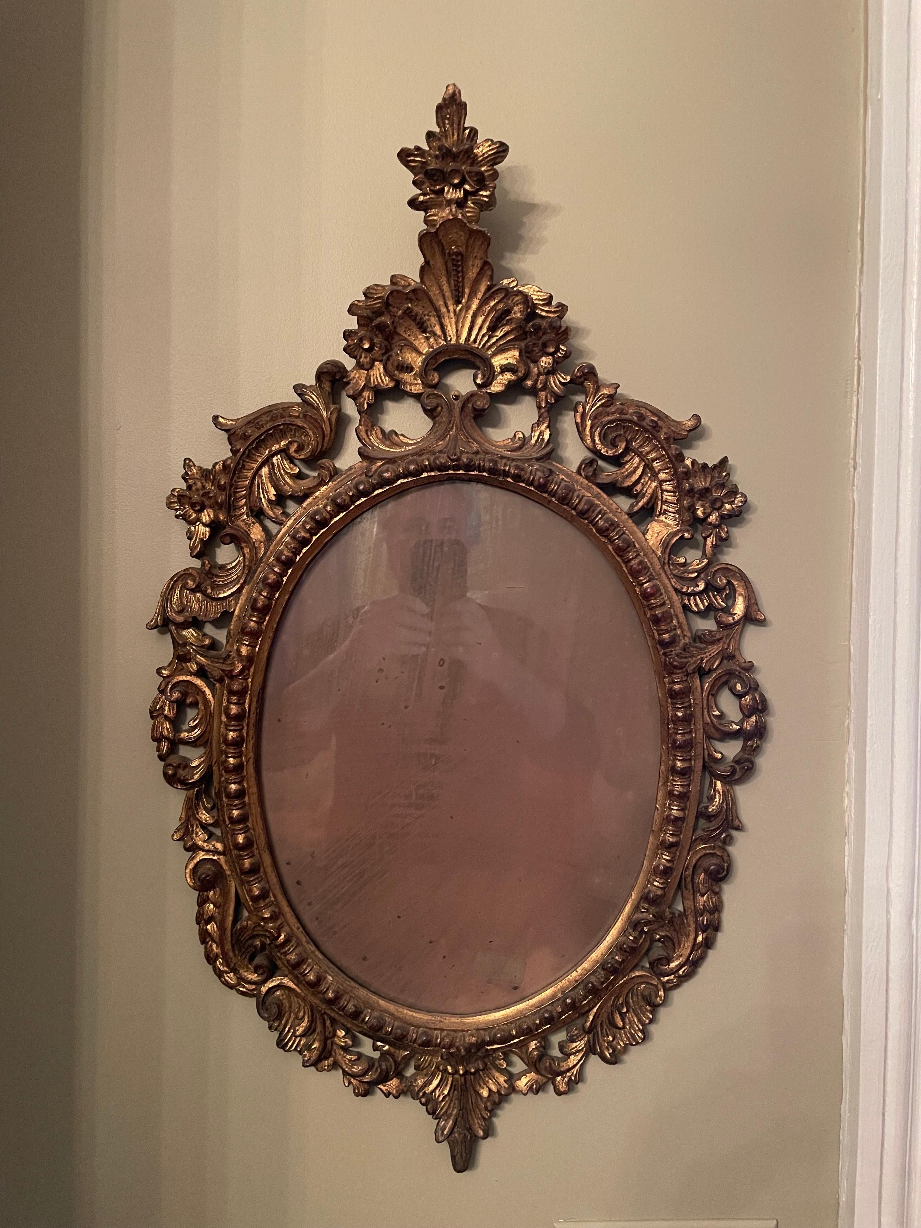 Great antique carved Rococo style giltwood Italian mirror. Distressed original mirror glass as shown in photos. Good overall condition . Measures 30
