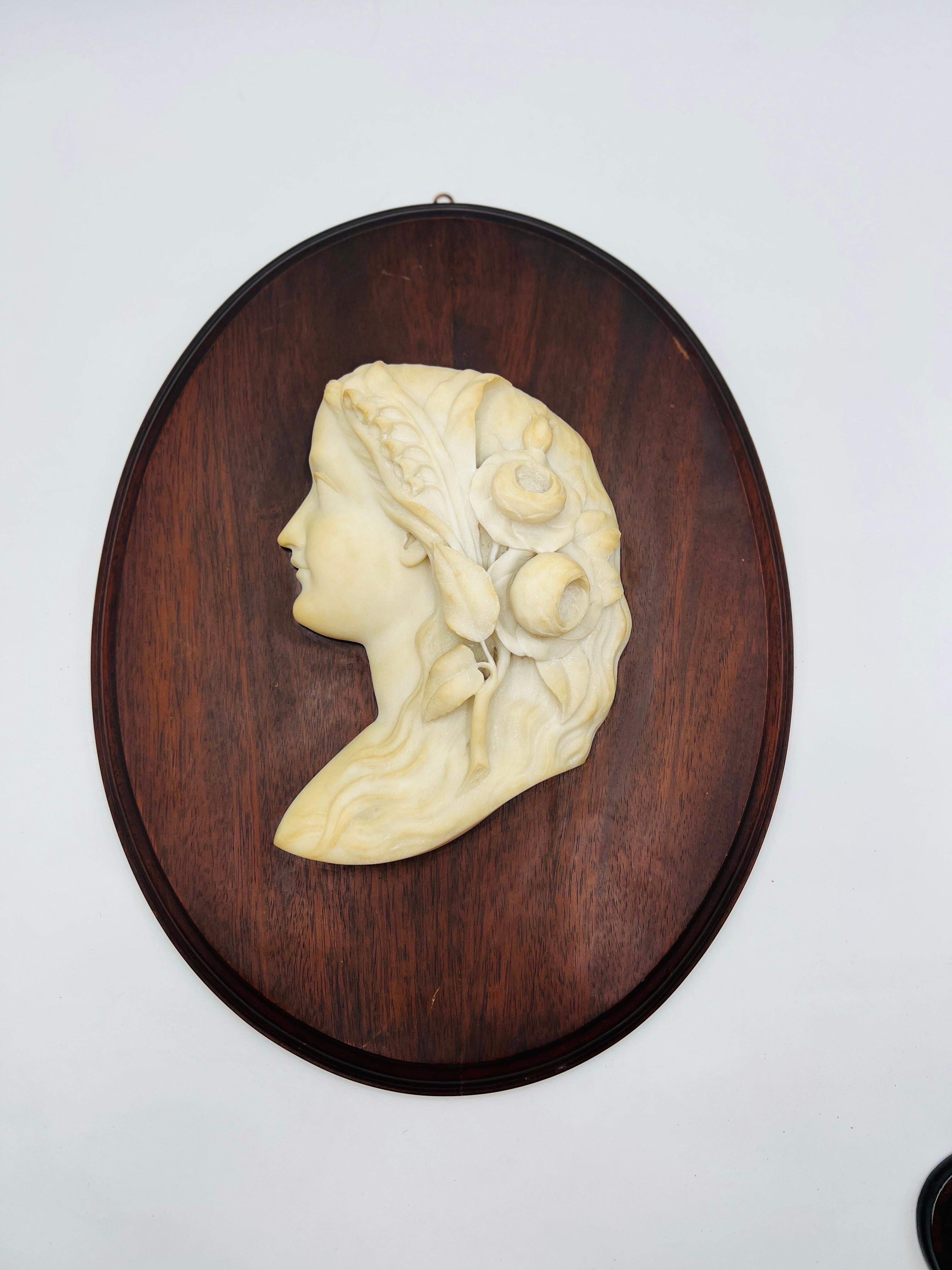 Antique Italian School Carved Marble Female Profile Aesthetic Plaque, circa 1890
A finely hand carved plaque depicting a beautiful female profile bust in white marble. Her hair is adorned with beautiful blossoms. Signed by an unidentified hand to