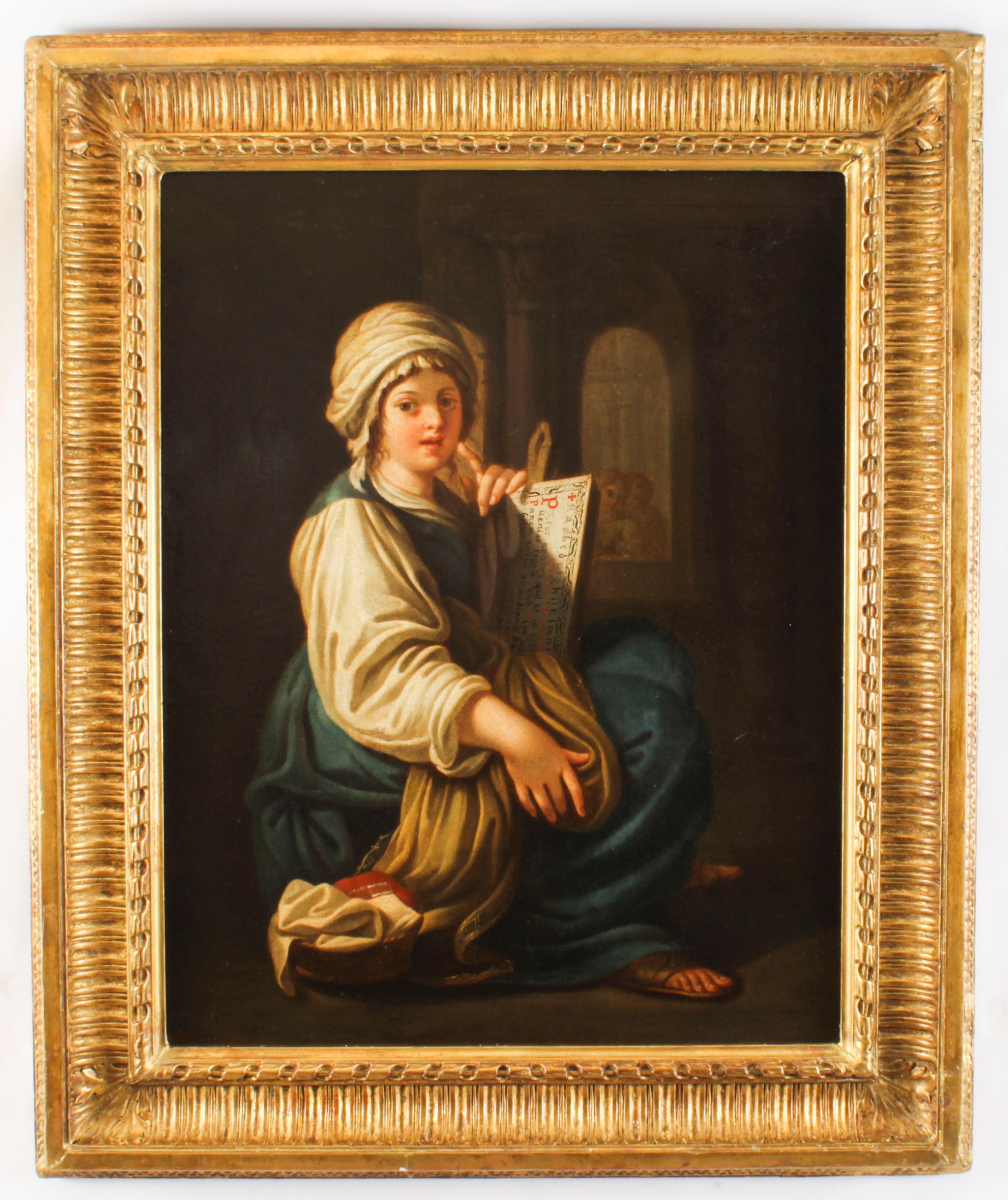 This is a magnificent antique Italian School, 19th Century, oil on canvas painting of a young lady reading a scroll,mid 19th century in date.

This stunning painting features the bust-length portrait of a beautiful young woman, wearing blue and