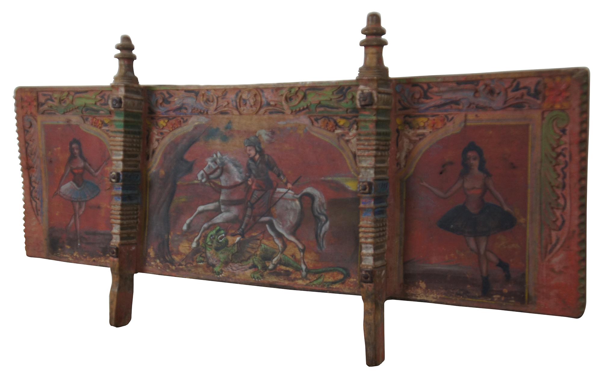 Antique Scicilian Carretto carved and Folk Art painted wooden panel originally the rear-most side of a donkey or small horse cart. The vertical posts would slot into matching holes on the floor of the cart. The center portion shows Saint George
